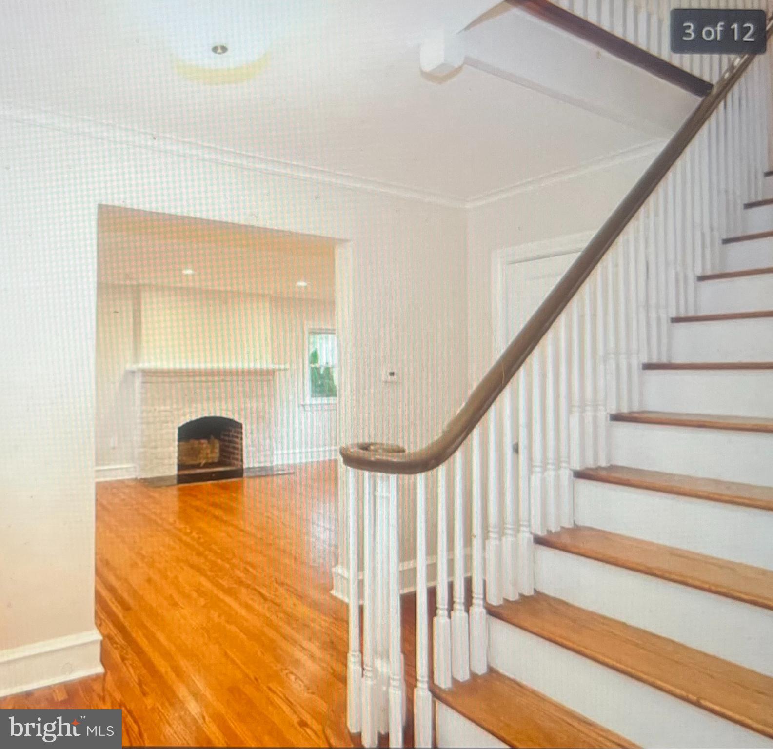 4001 State Road Upper Darby, PA 19026 - Photo 3 of 9 a view of a livingroom with wooden floor and a fireplace
