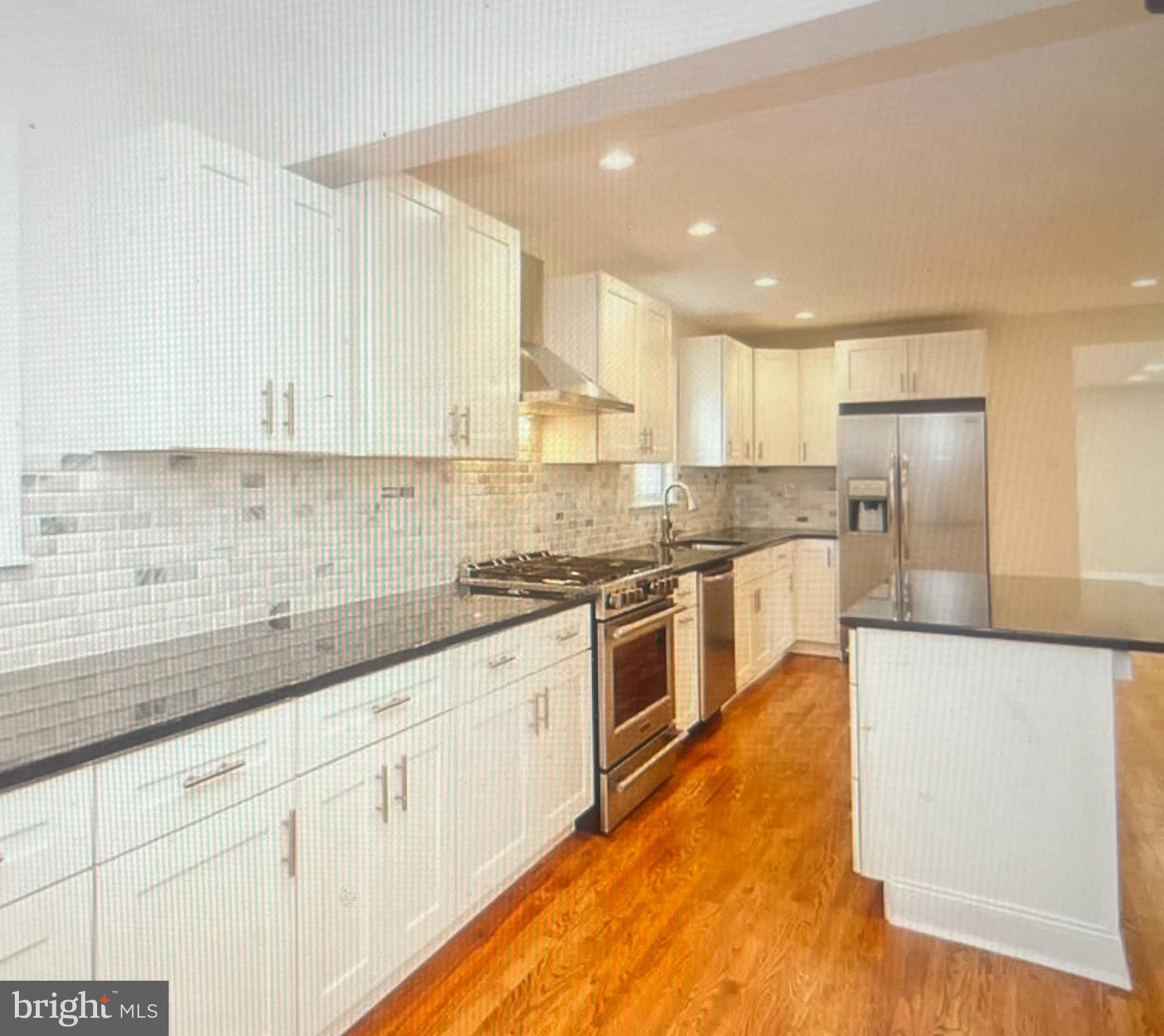 4001 State Road Upper Darby, PA 19026 - Photo 5 of 9 a kitchen with granite countertop white cabinets and white appliances