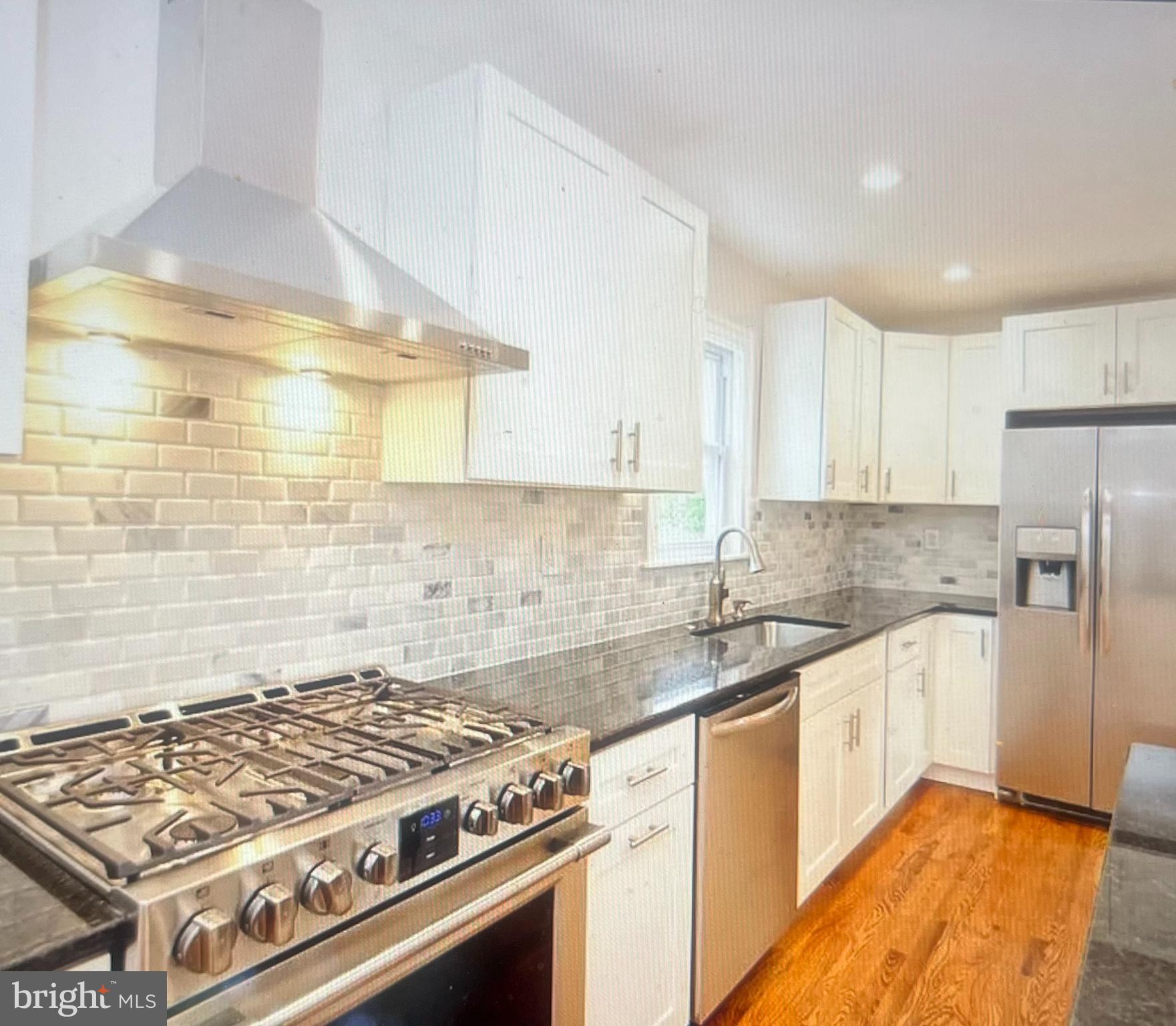 4001 State Road Upper Darby, PA 19026 - Photo 6 of 9 a kitchen with a stove a sink and a refrigerator
