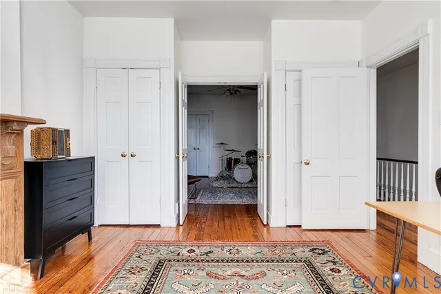 a spacious bathroom with a tub sink and mirror