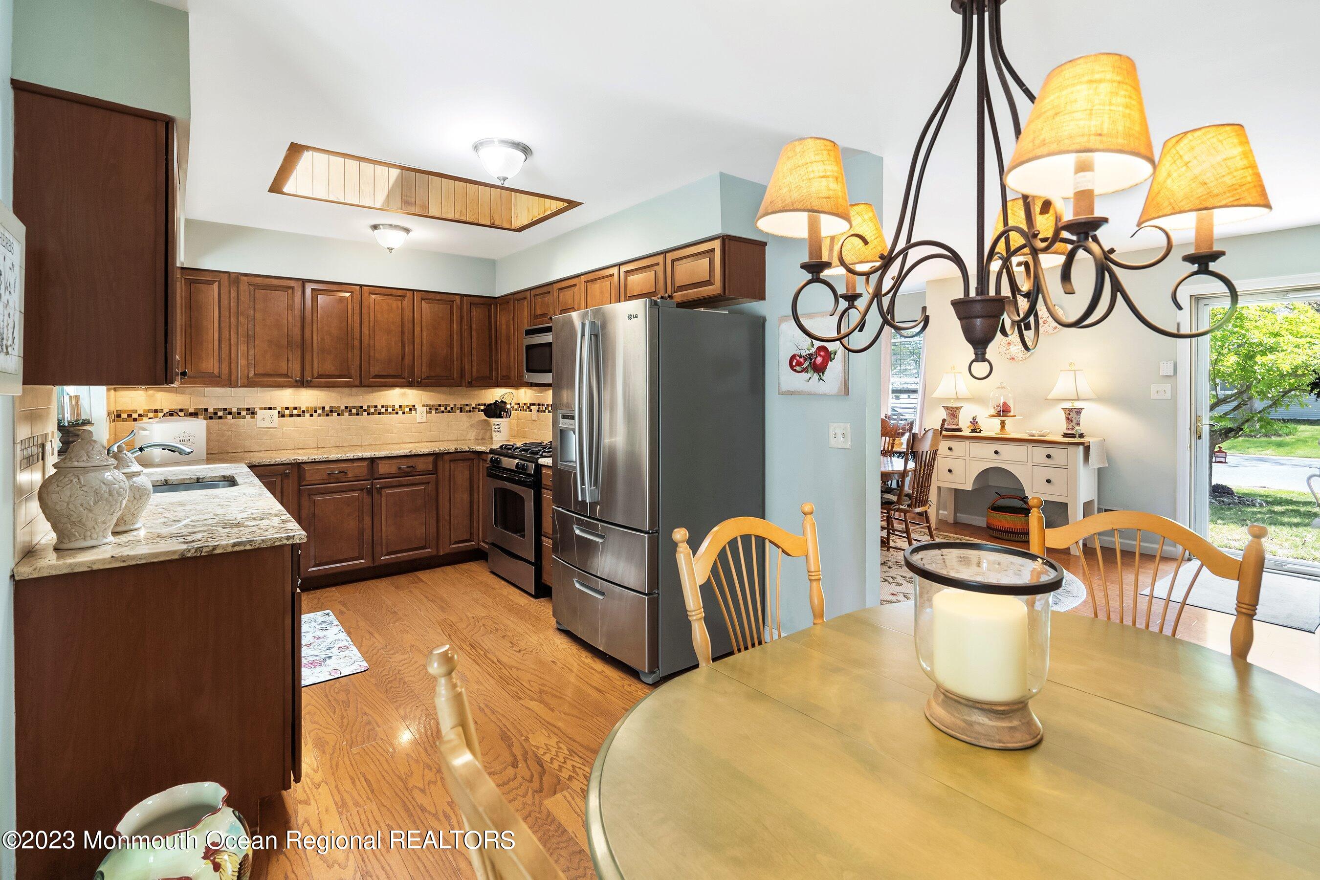 370 Constitution Drive Forked River, NJ 08731 - Photo 12 of 25 a kitchen with a sink appliances and cabinets