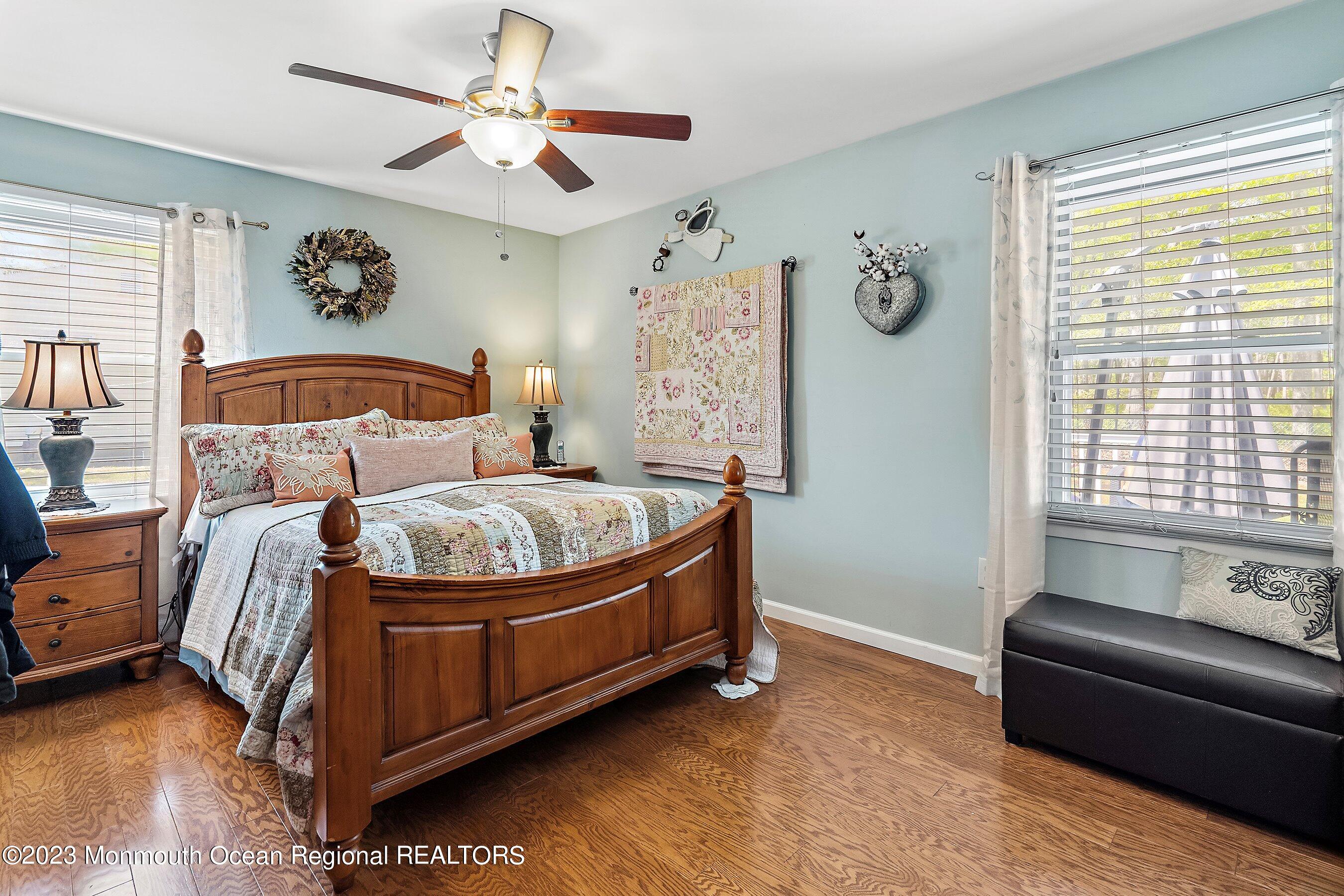 370 Constitution Drive Forked River, NJ 08731 - Photo 15 of 25 a bedroom with a bed and a couch