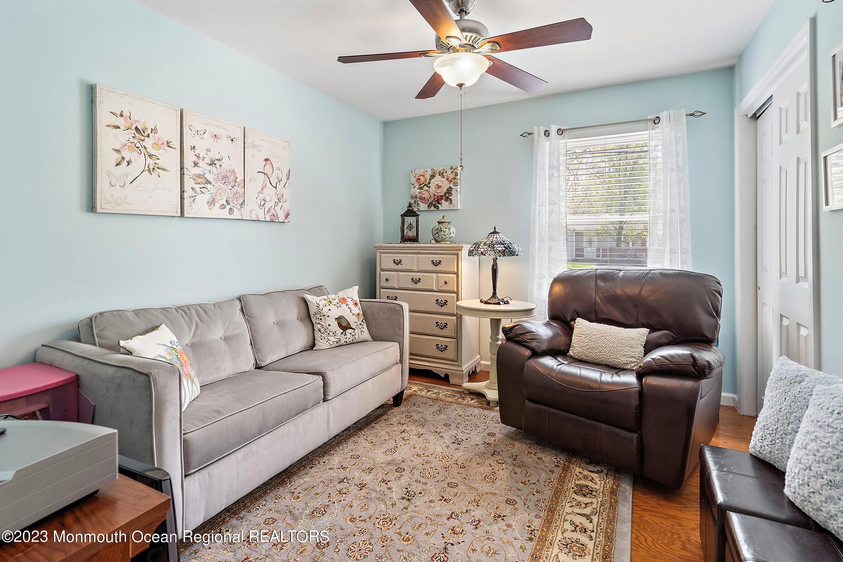 370 Constitution Drive Forked River, NJ 08731 - Photo 17 of 25 a living room with furniture and a window