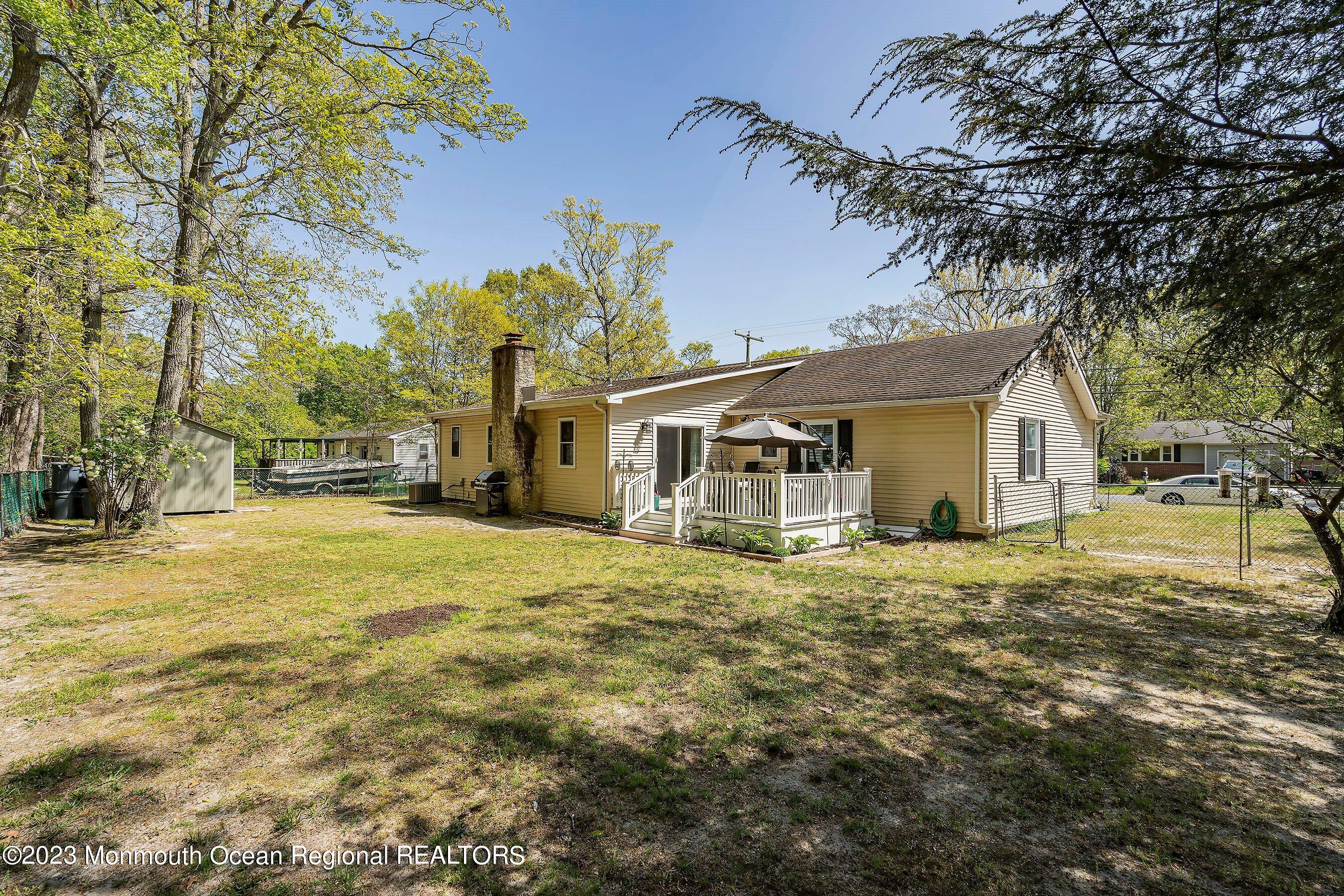 370 Constitution Drive Forked River, NJ 08731 - Photo 21 of 25 a front view of a house with a garden