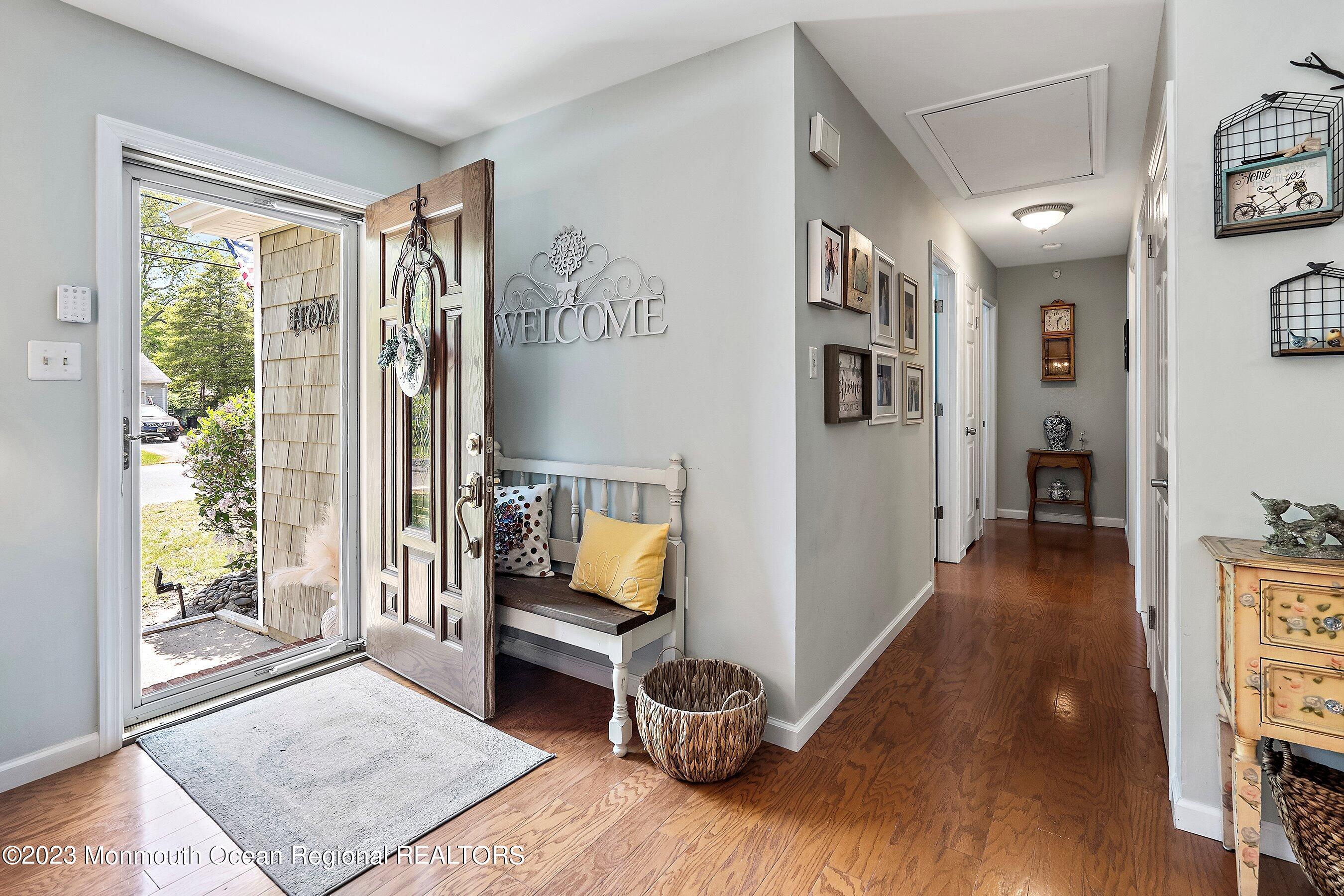 370 Constitution Drive Forked River, NJ 08731 - Photo 3 of 25 a living room with furniture and a wooden floor