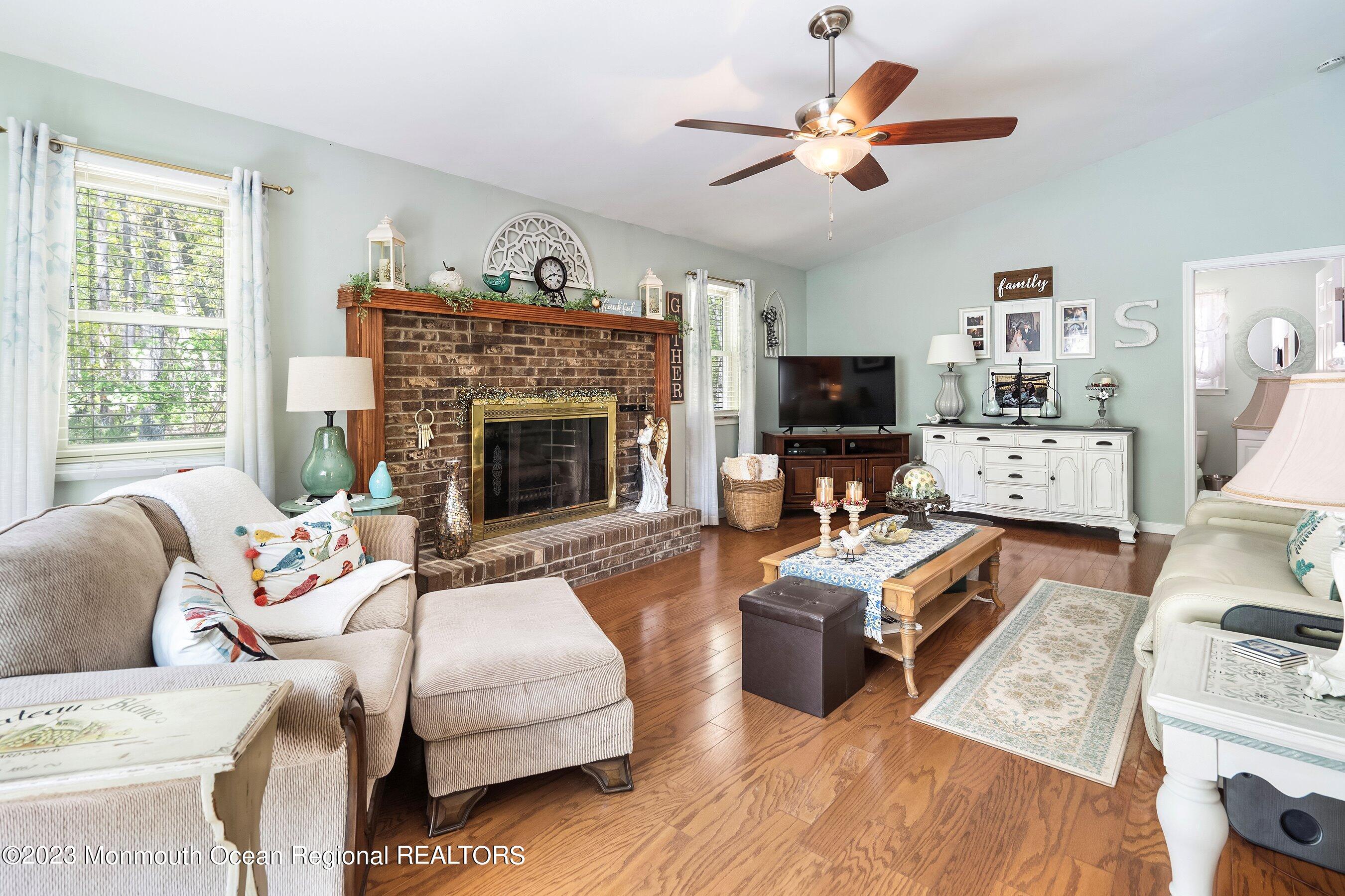 370 Constitution Drive Forked River, NJ 08731 - Photo 4 of 25 a living room with furniture fireplace and flat screen tv
