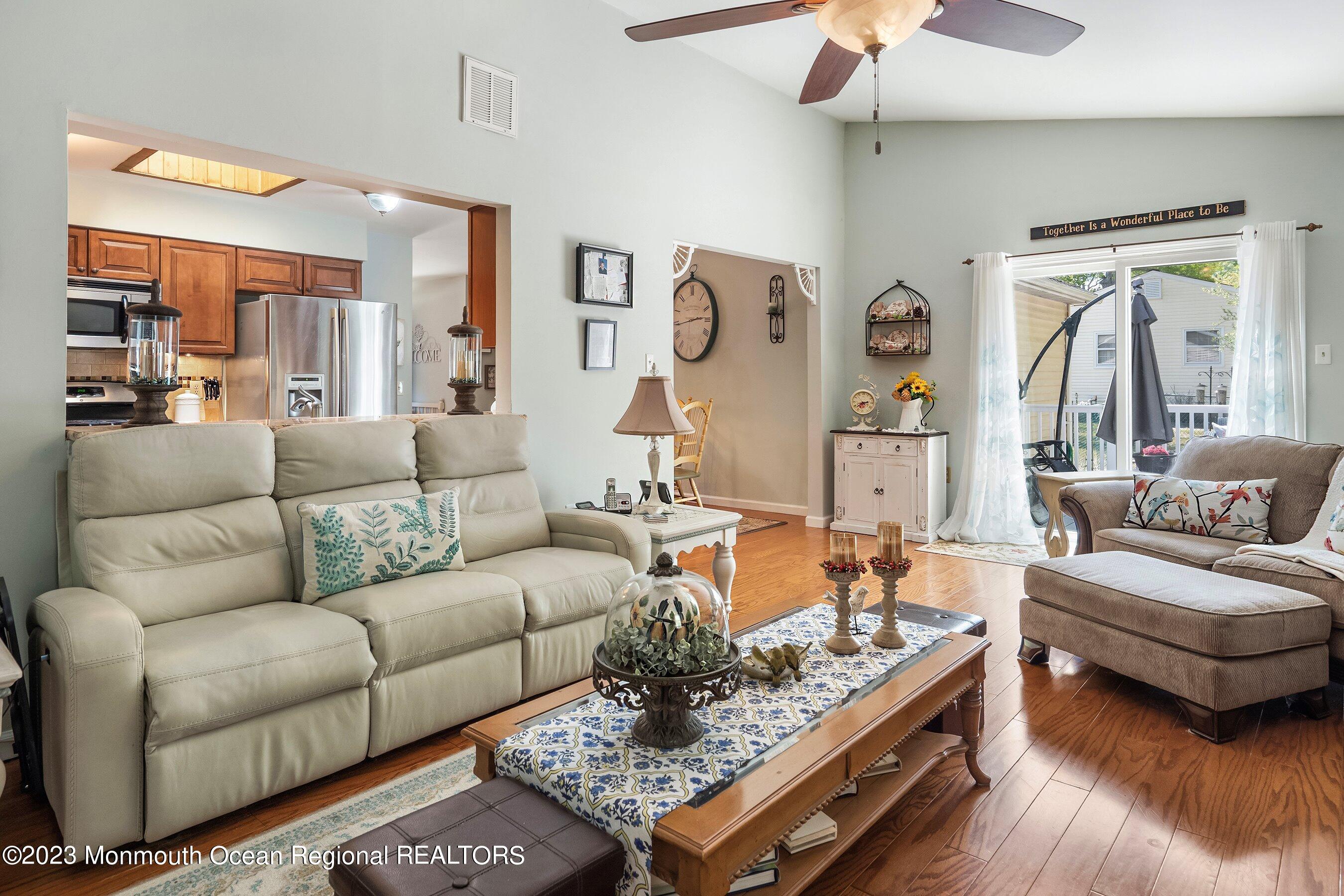 370 Constitution Drive Forked River, NJ 08731 - Photo 5 of 25 a living room with furniture and a large window