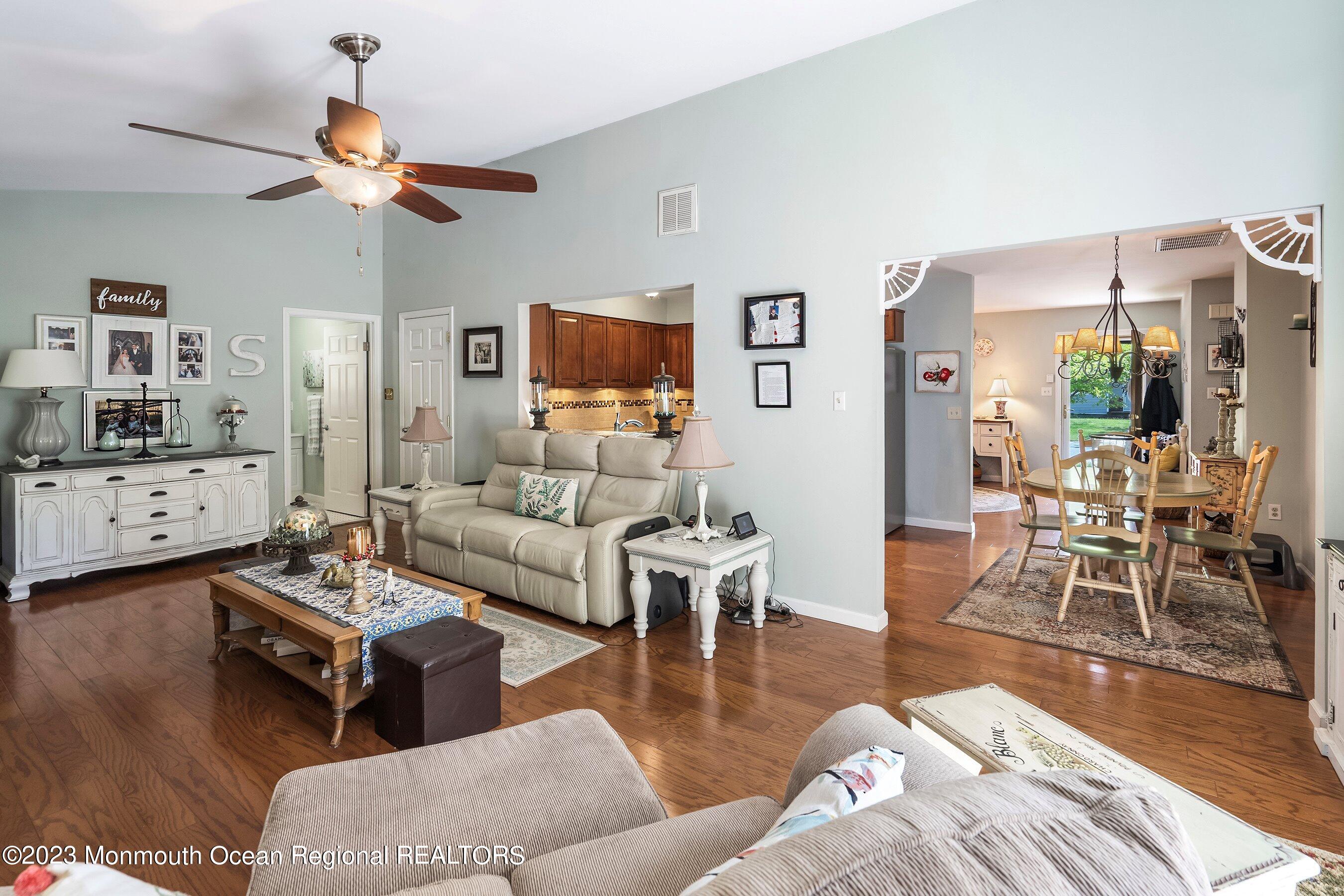 370 Constitution Drive Forked River, NJ 08731 - Photo 7 of 25 a living room with furniture wooden floor and a flat screen tv