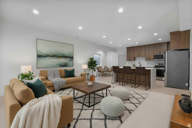 710 East Mountain Road North Ogden, UT 84414 - Photo 11 of 36 Enhanced staged photo. Basement apartment ADU Living area with recessed lighting
