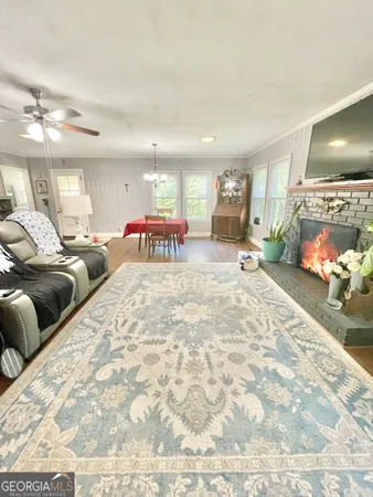 a bedroom with furniture and a flat screen tv