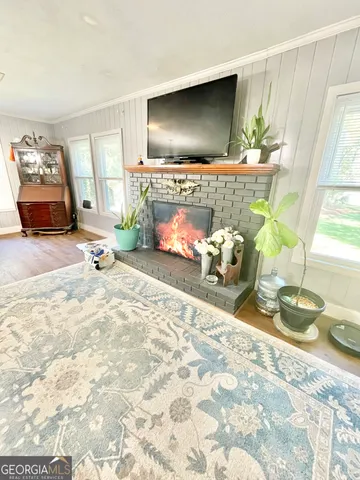 a room with a couch and a flat screen tv