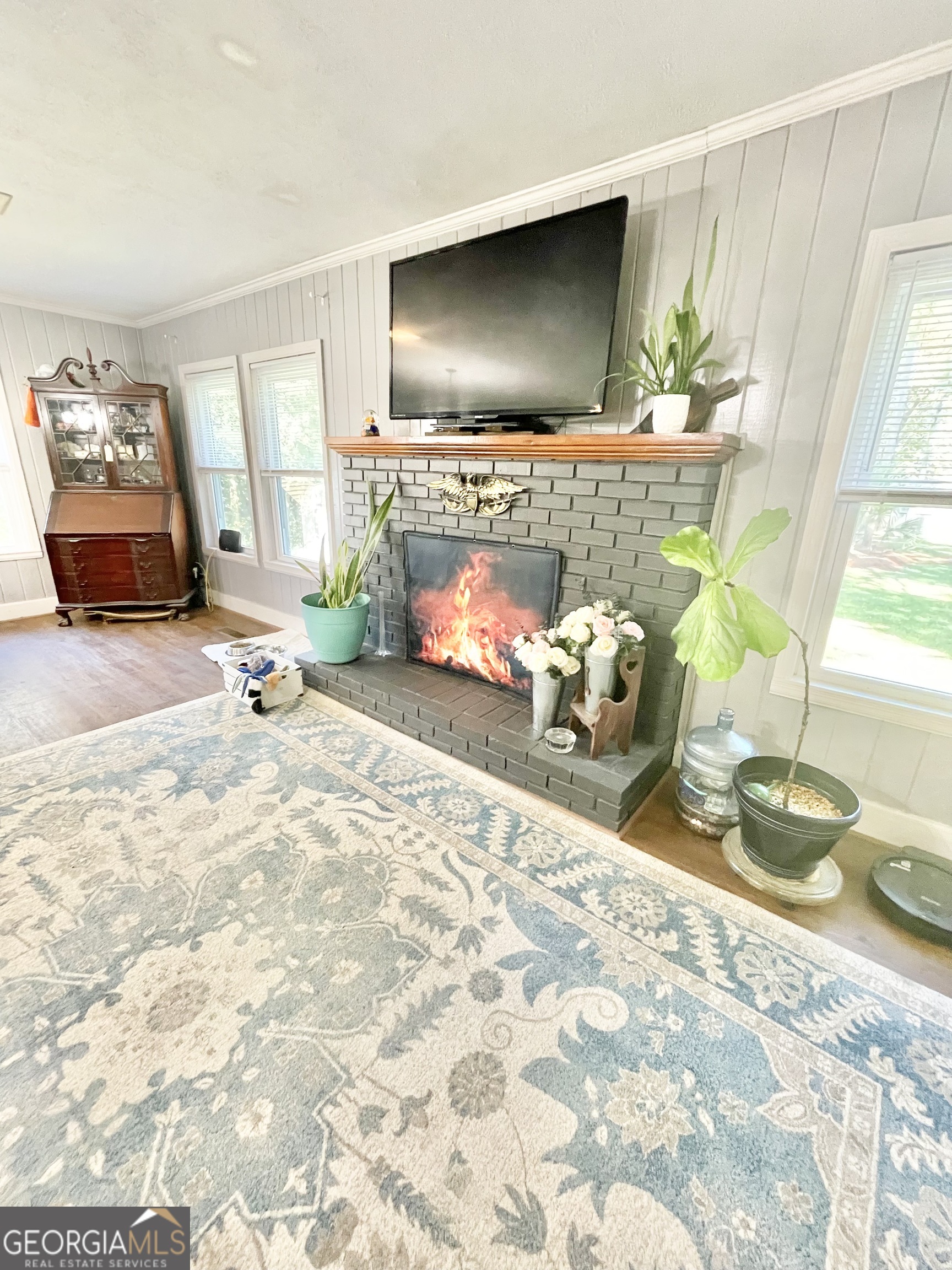 883 4th Avenue Rochelle, GA 31079 - Photo 12 of 34 a room with a couch and a flat screen tv