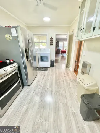 a room with wooden floor and furniture