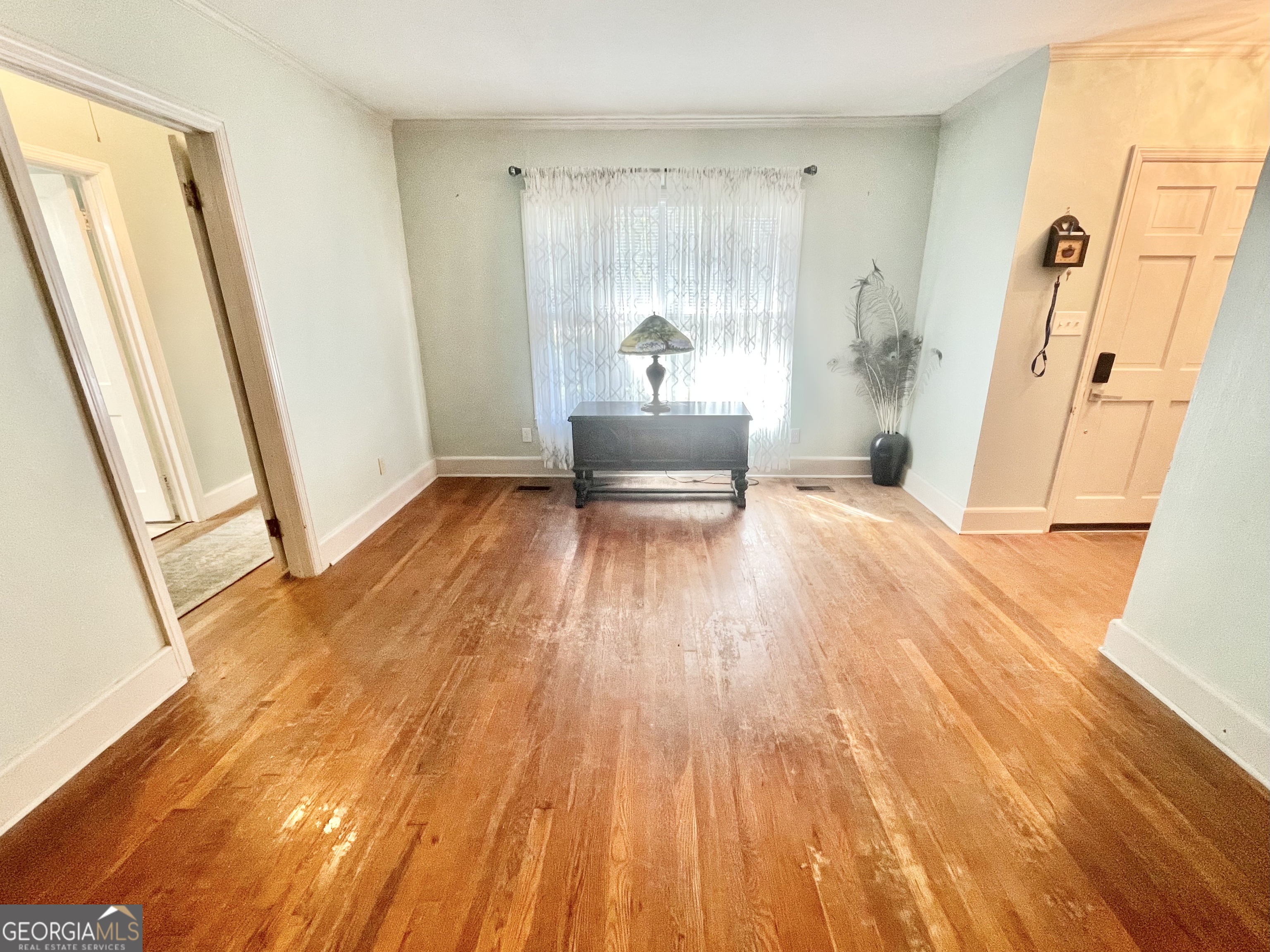 883 4th Avenue Rochelle, GA 31079 - Photo 18 of 34 a view of a bedroom with wooden floor and a sink