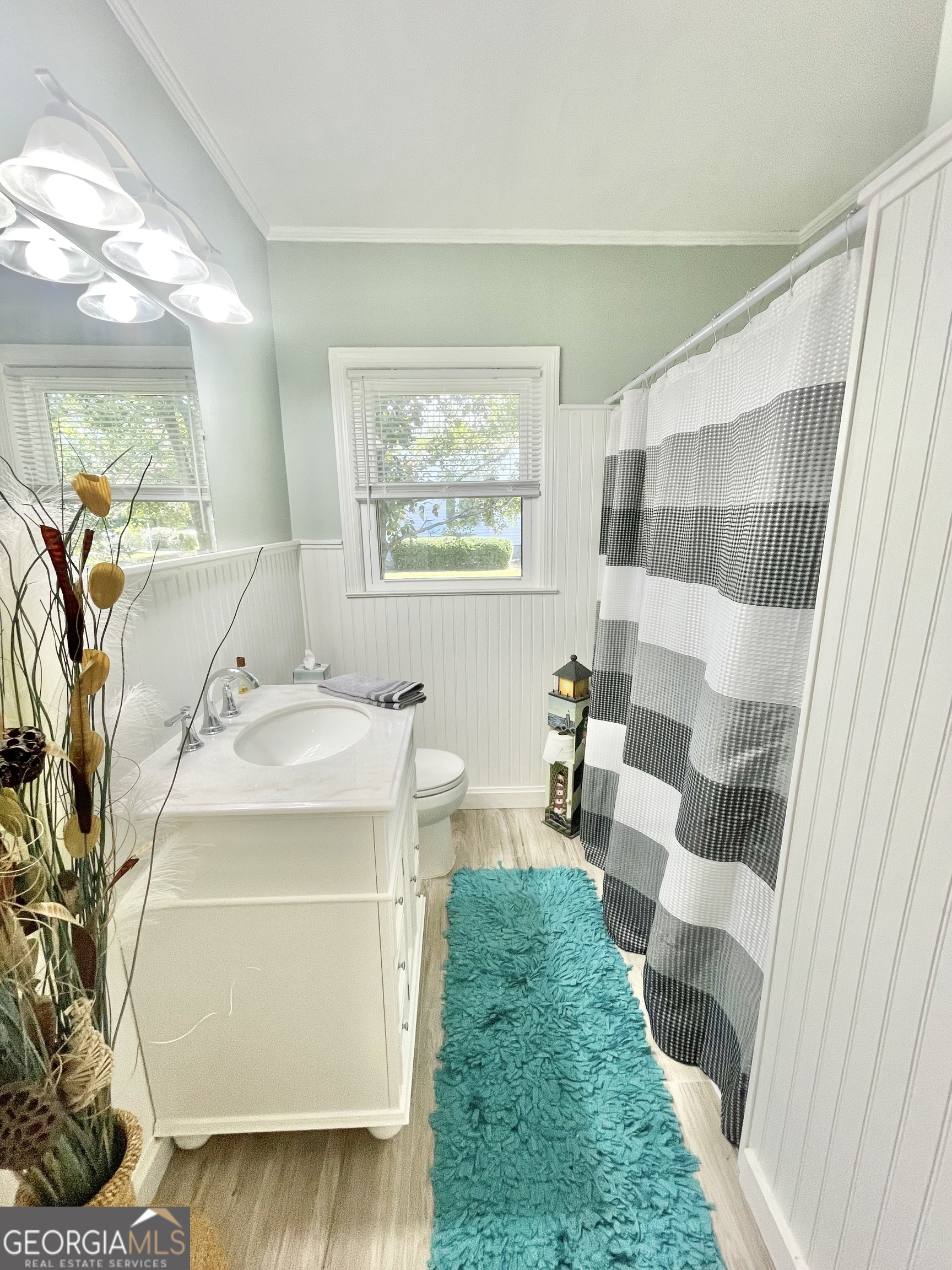 883 4th Avenue Rochelle, GA 31079 - Photo 23 of 34 a spacious bathroom with a sink and mirror with bathtub