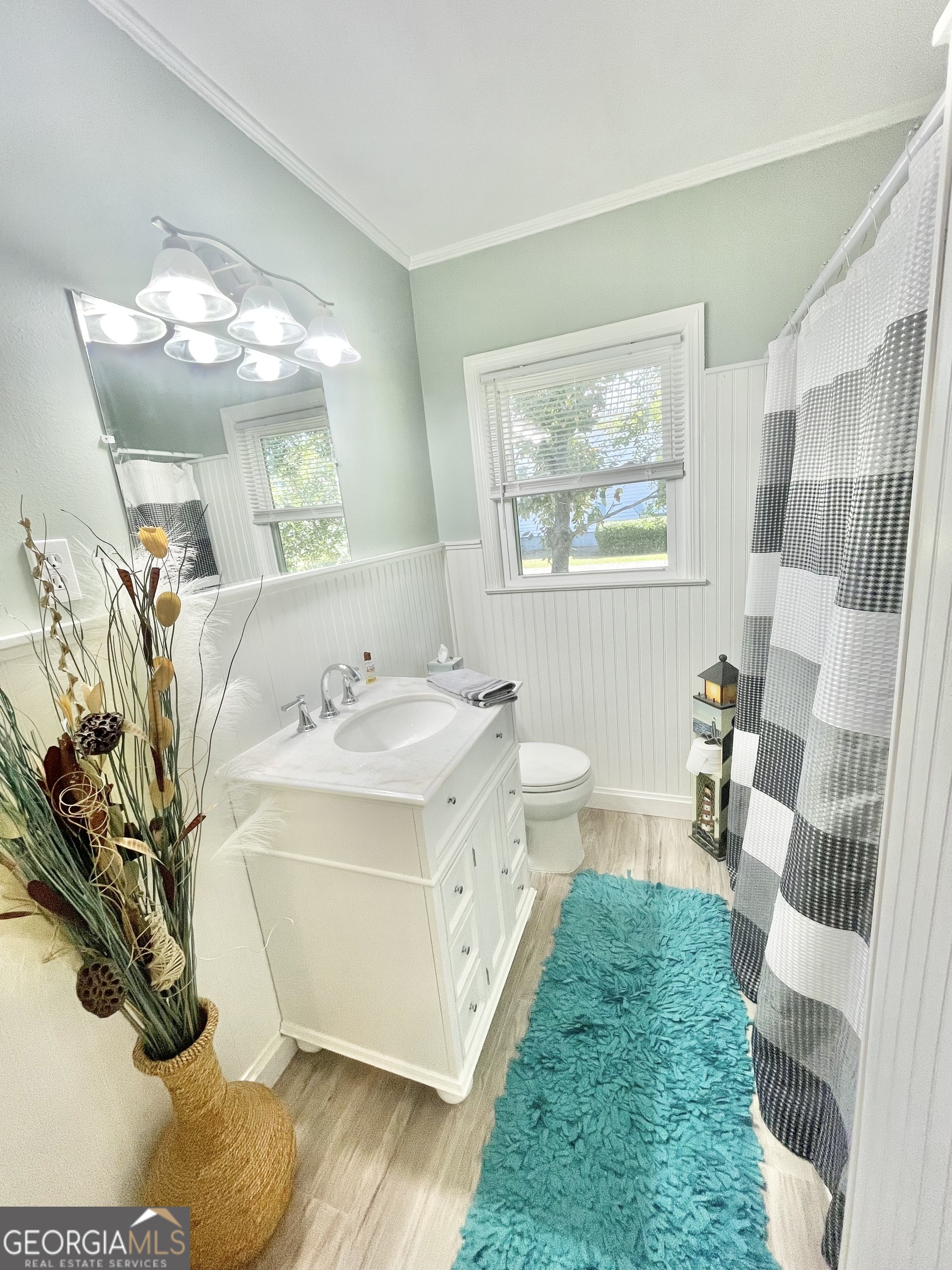 883 4th Avenue Rochelle, GA 31079 - Photo 24 of 34 a spacious bathroom with a double vanity sink and a mirror