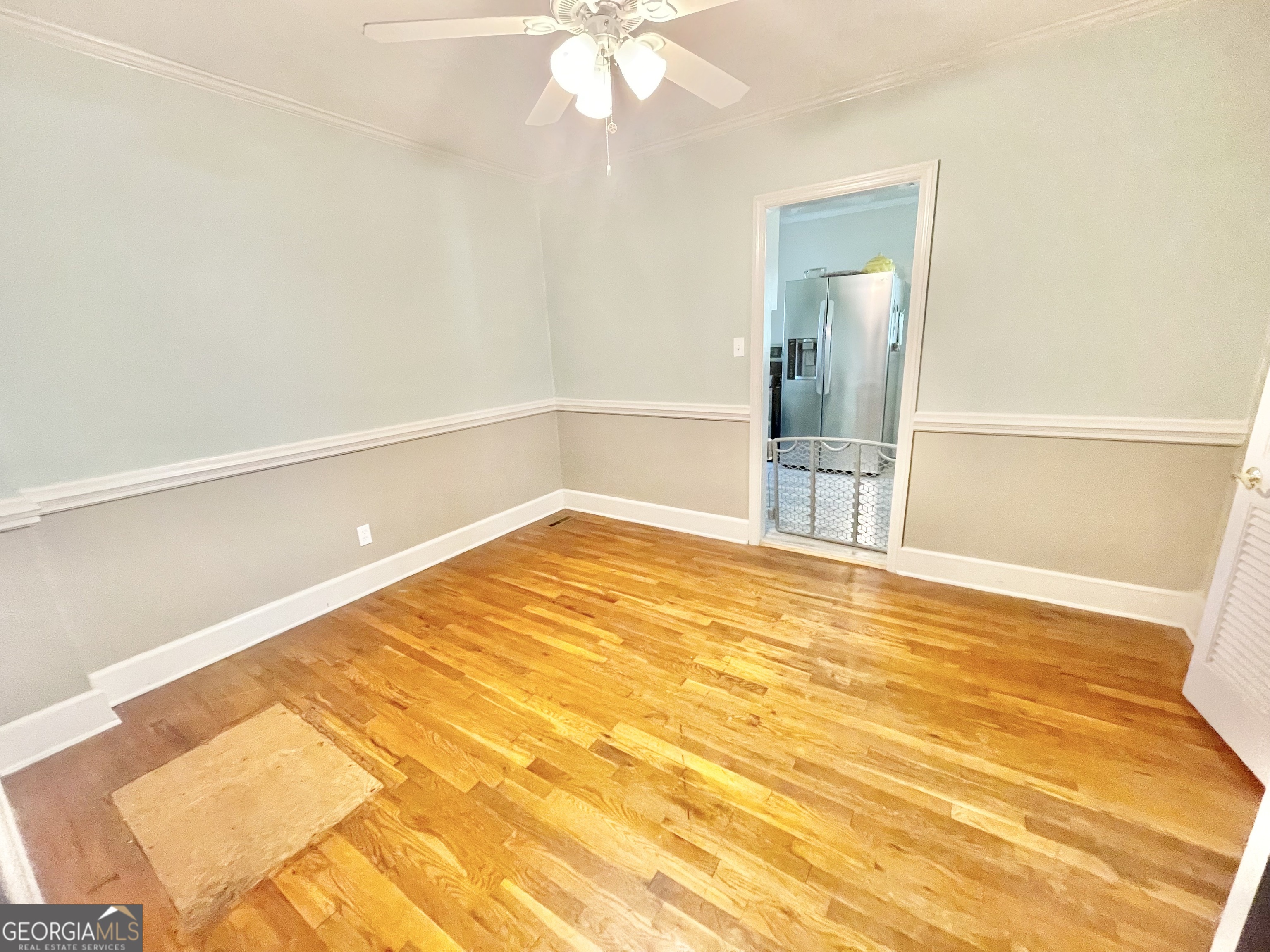 883 4th Avenue Rochelle, GA 31079 - Photo 25 of 34 a view of a room with wooden floor and white walls