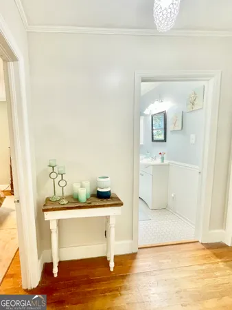 a view of living room with furniture and wooden floor