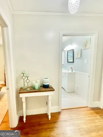 a view of living room with furniture and wooden floor