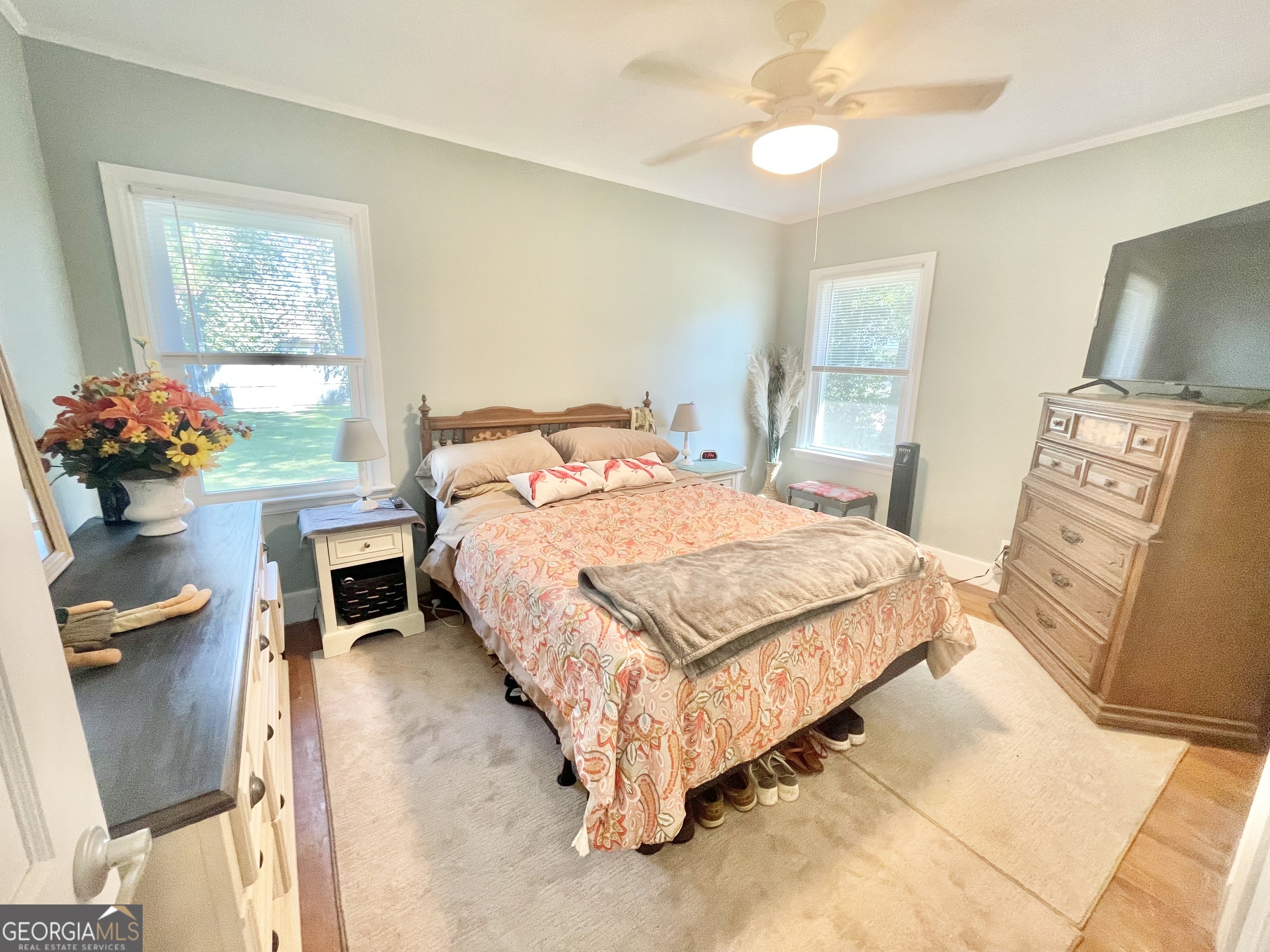883 4th Avenue Rochelle, GA 31079 - Photo 28 of 34 a bedroom with a bed and a chandelier