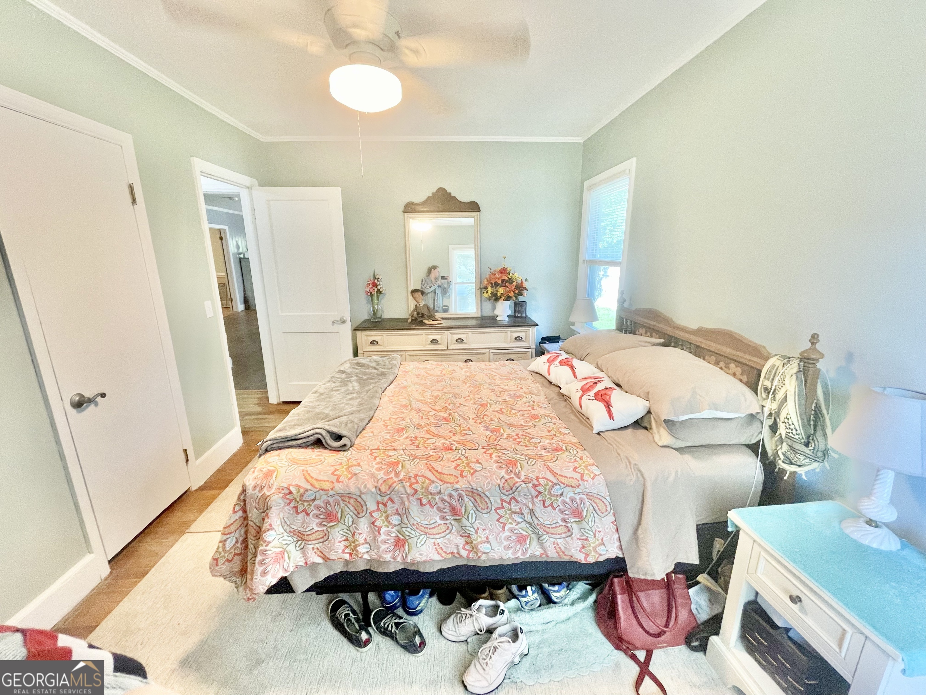 883 4th Avenue Rochelle, GA 31079 - Photo 30 of 34 a bedroom with a bed and a mirror on the dresser