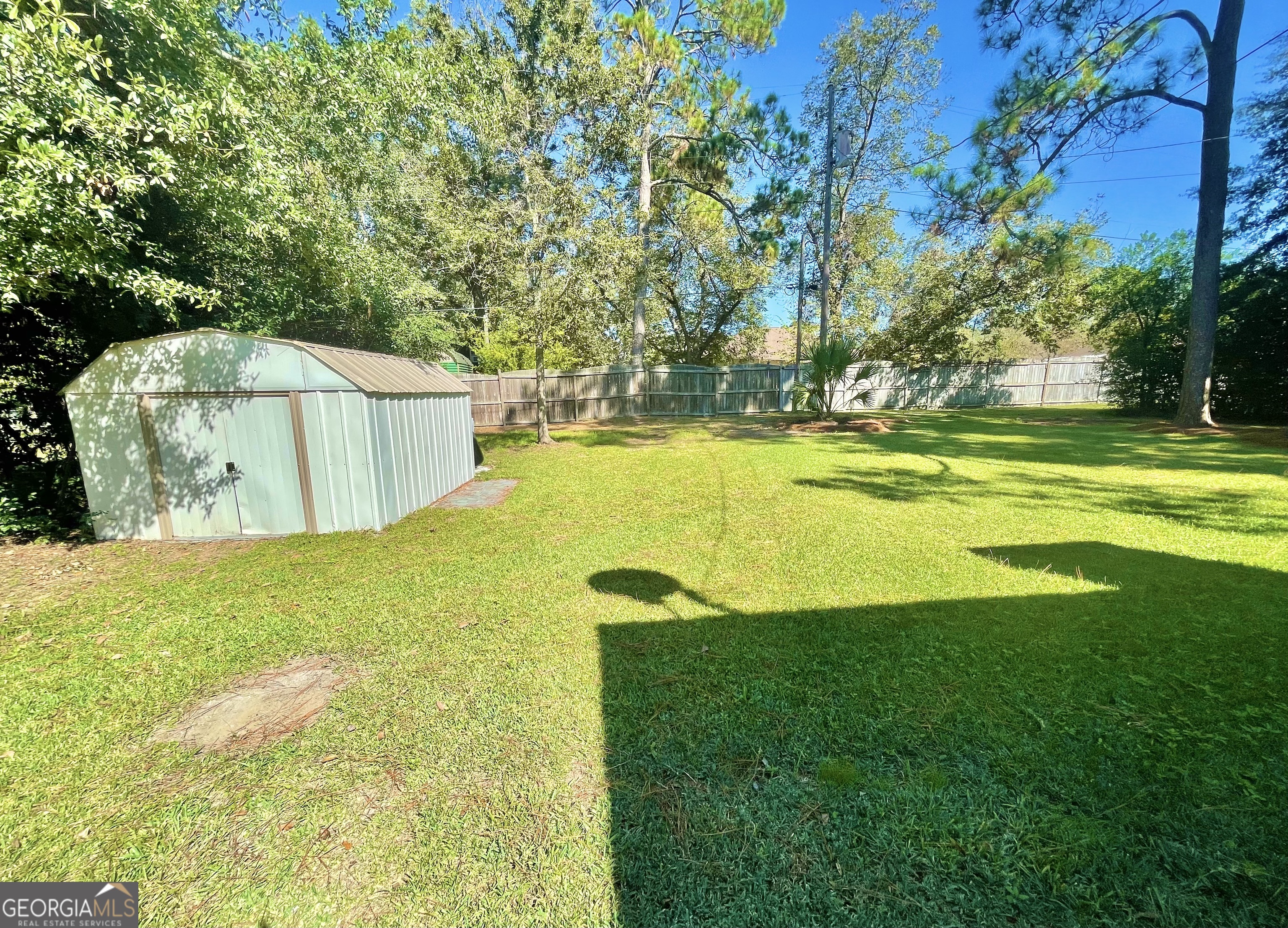 883 4th Avenue Rochelle, GA 31079 - Photo 31 of 34 a view of a swimming pool with an outdoor space and seating area