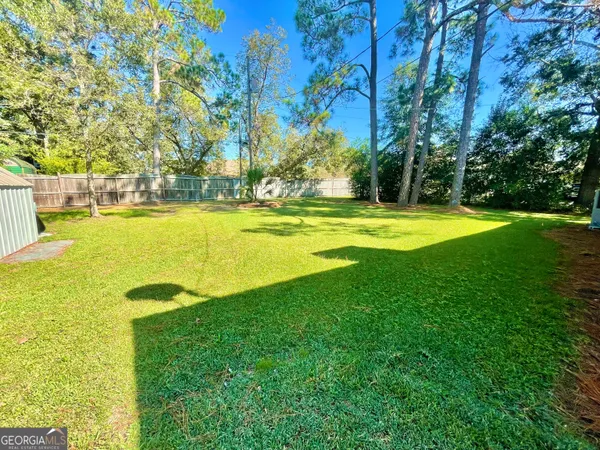 a view of a swimming pool with an outdoor space and seating area