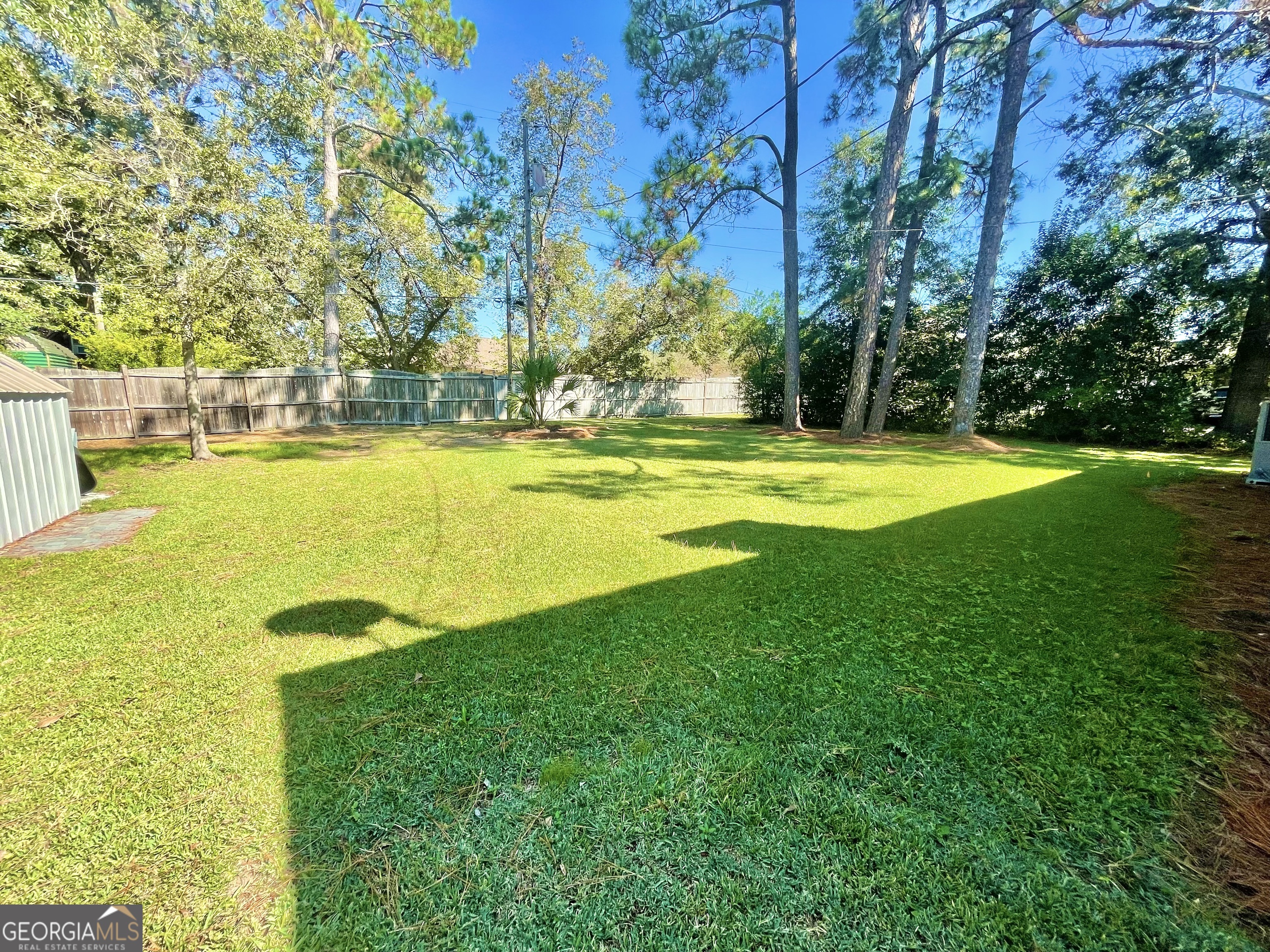 883 4th Avenue Rochelle, GA 31079 - Photo 32 of 34 a view of a swimming pool with an outdoor space and seating area