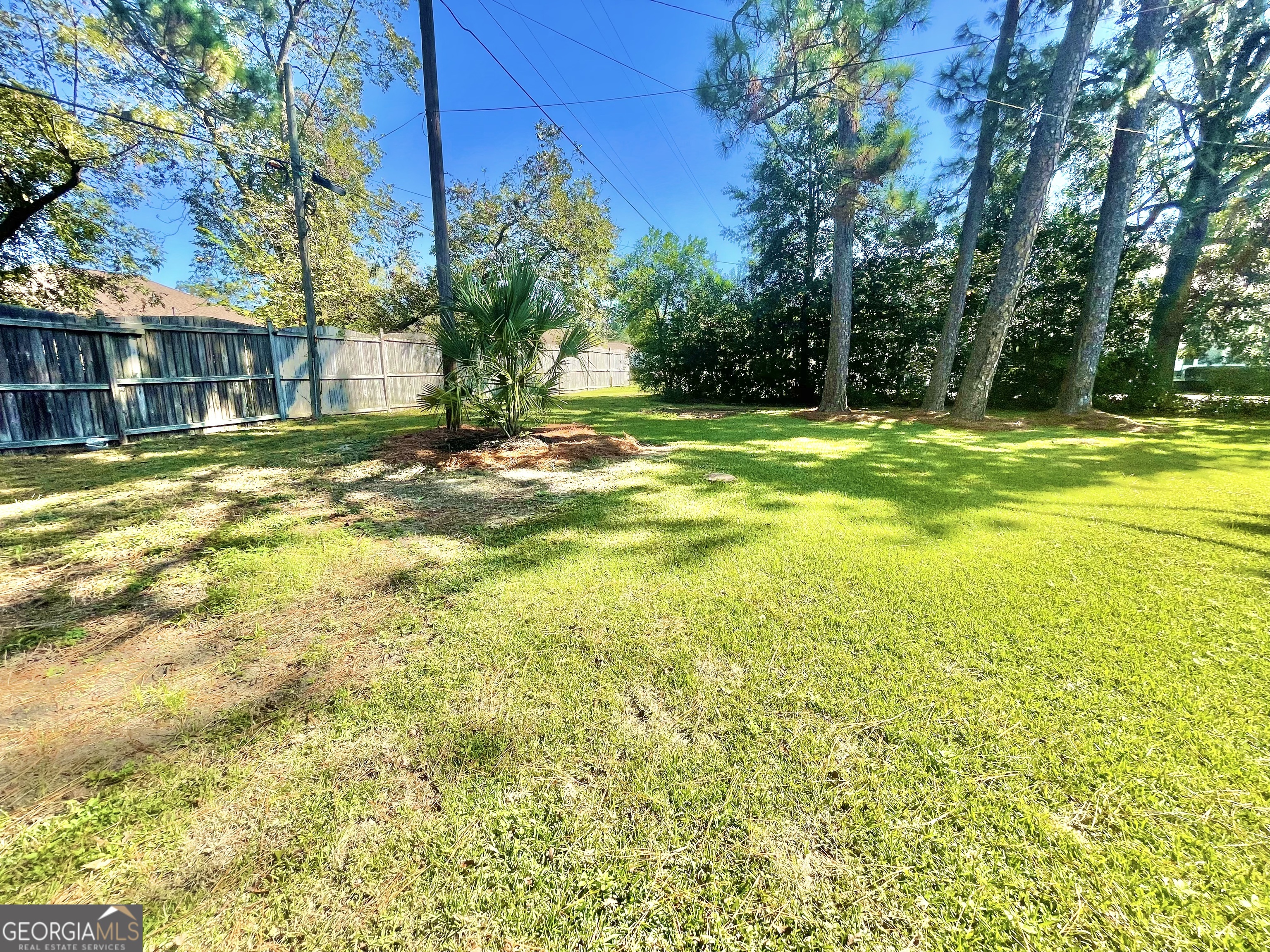 883 4th Avenue Rochelle, GA 31079 - Photo 33 of 34 a view of a swimming pool with an outdoor space and seating area