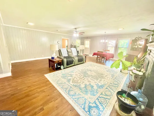 a living room with furniture and a table