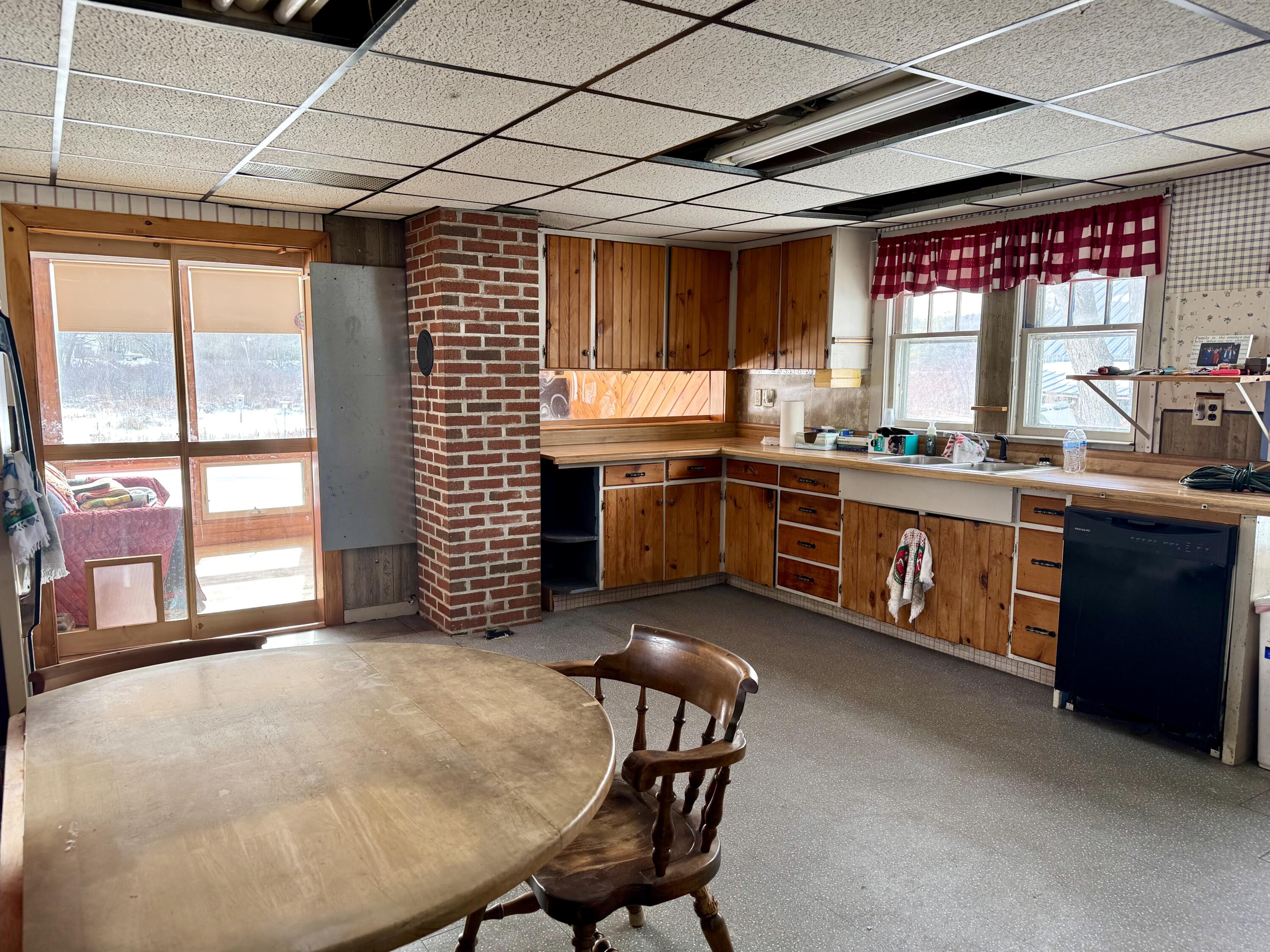 16 Heath Street Oakland, ME 04963 - Photo 4 of 8 Kitchen and Sunroom