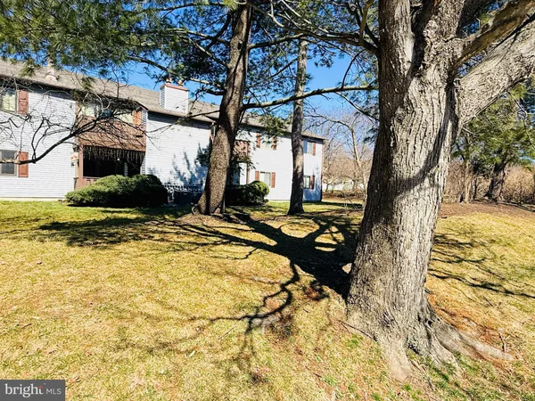 a view of a backyard of the house