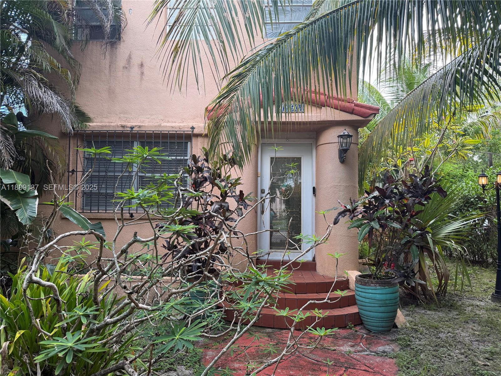 901 Southwest 19th Avenue Miami, FL 33135 - Photo 14 of 60 a front view of house with outdoor seating and plants