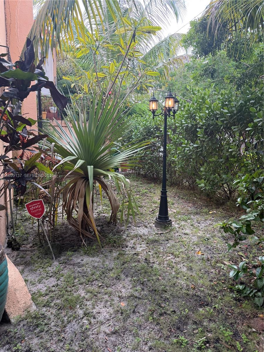 901 Southwest 19th Avenue Miami, FL 33135 - Photo 17 of 60 a flag is sitting in the middle of a yard