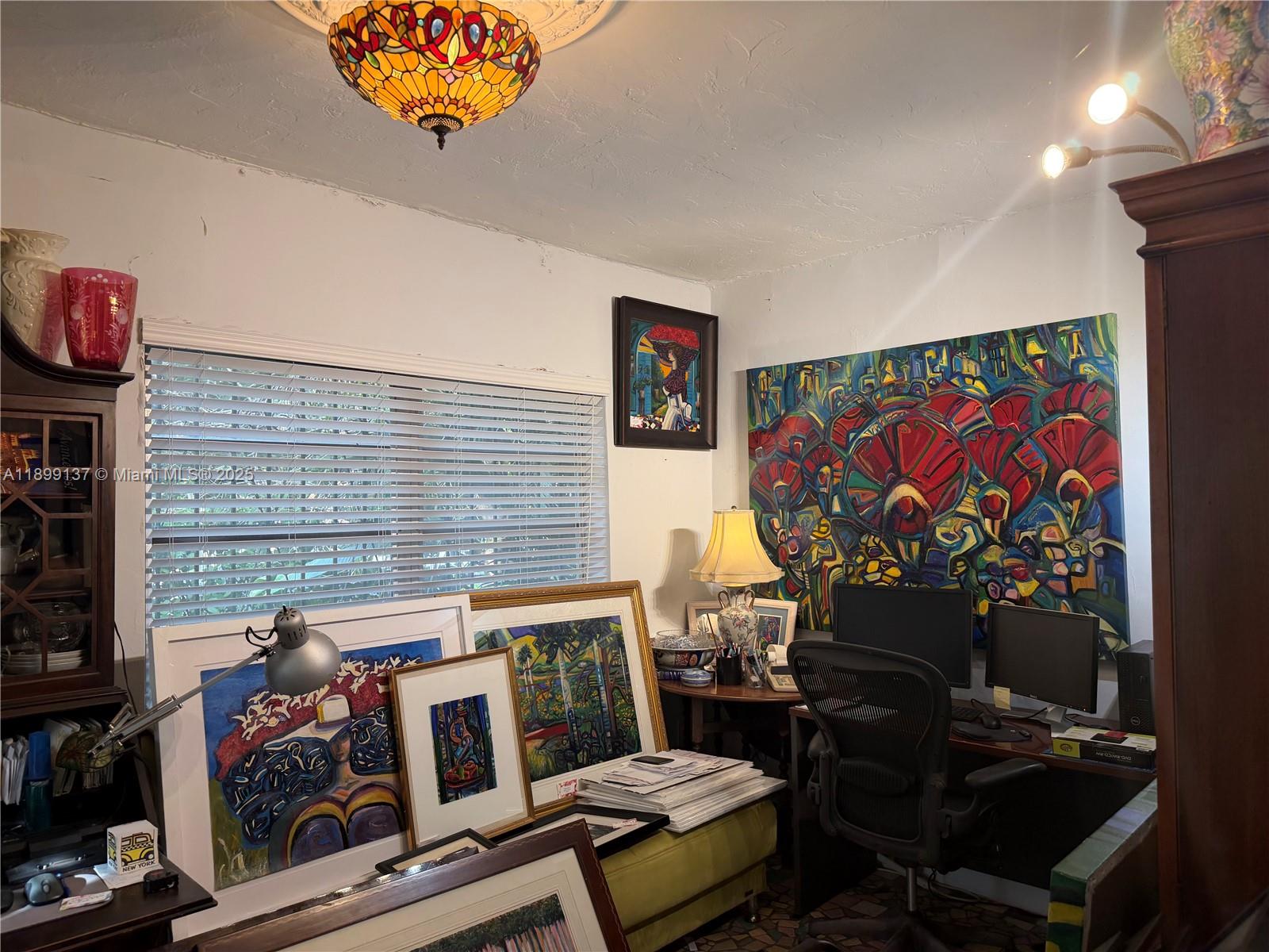 901 Southwest 19th Avenue Miami, FL 33135 - Photo 22 of 60 a living room with furniture a rug and a fireplace