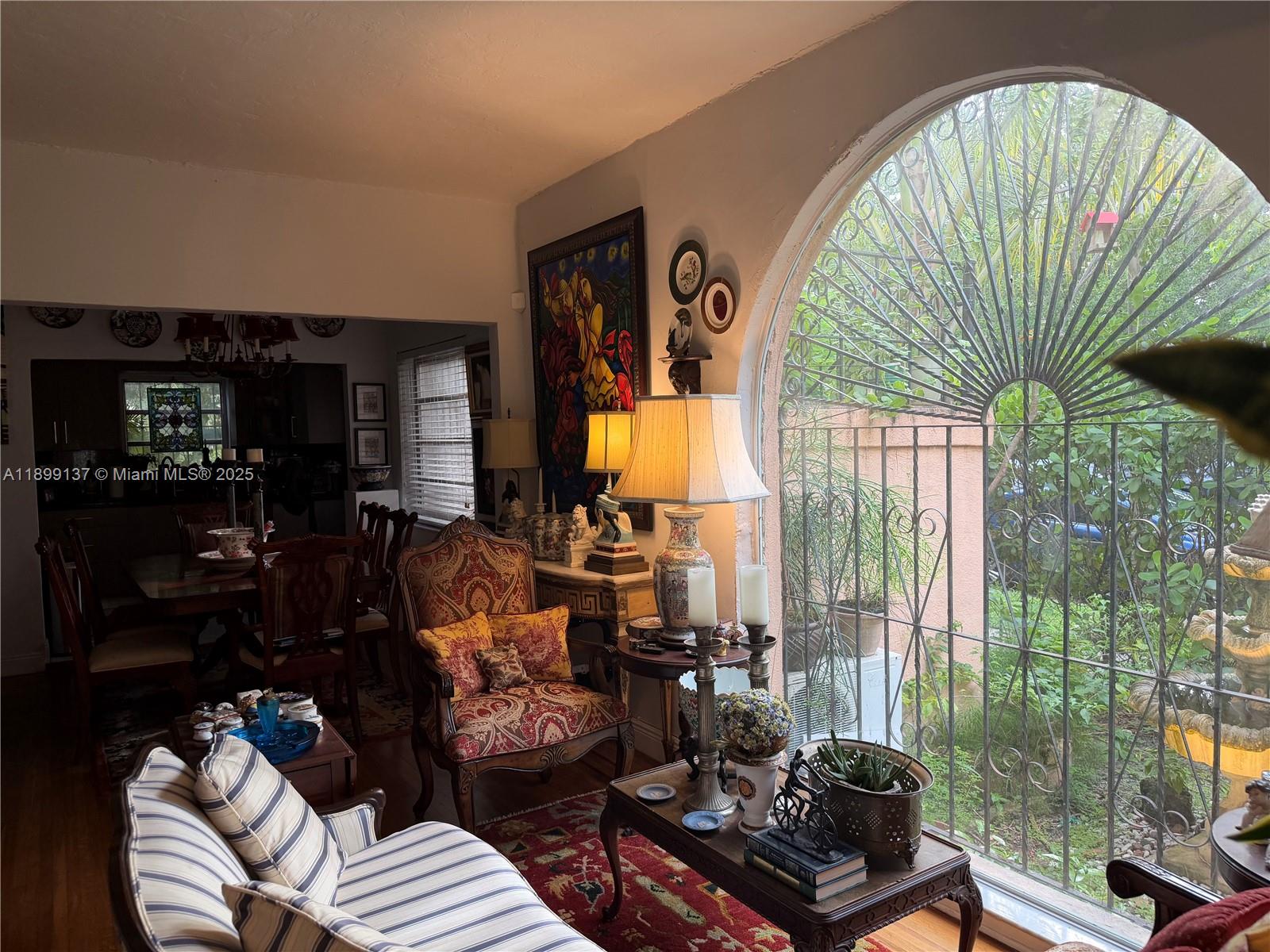901 Southwest 19th Avenue Miami, FL 33135 - Photo 24 of 60 a living room with furniture and a floor to ceiling window