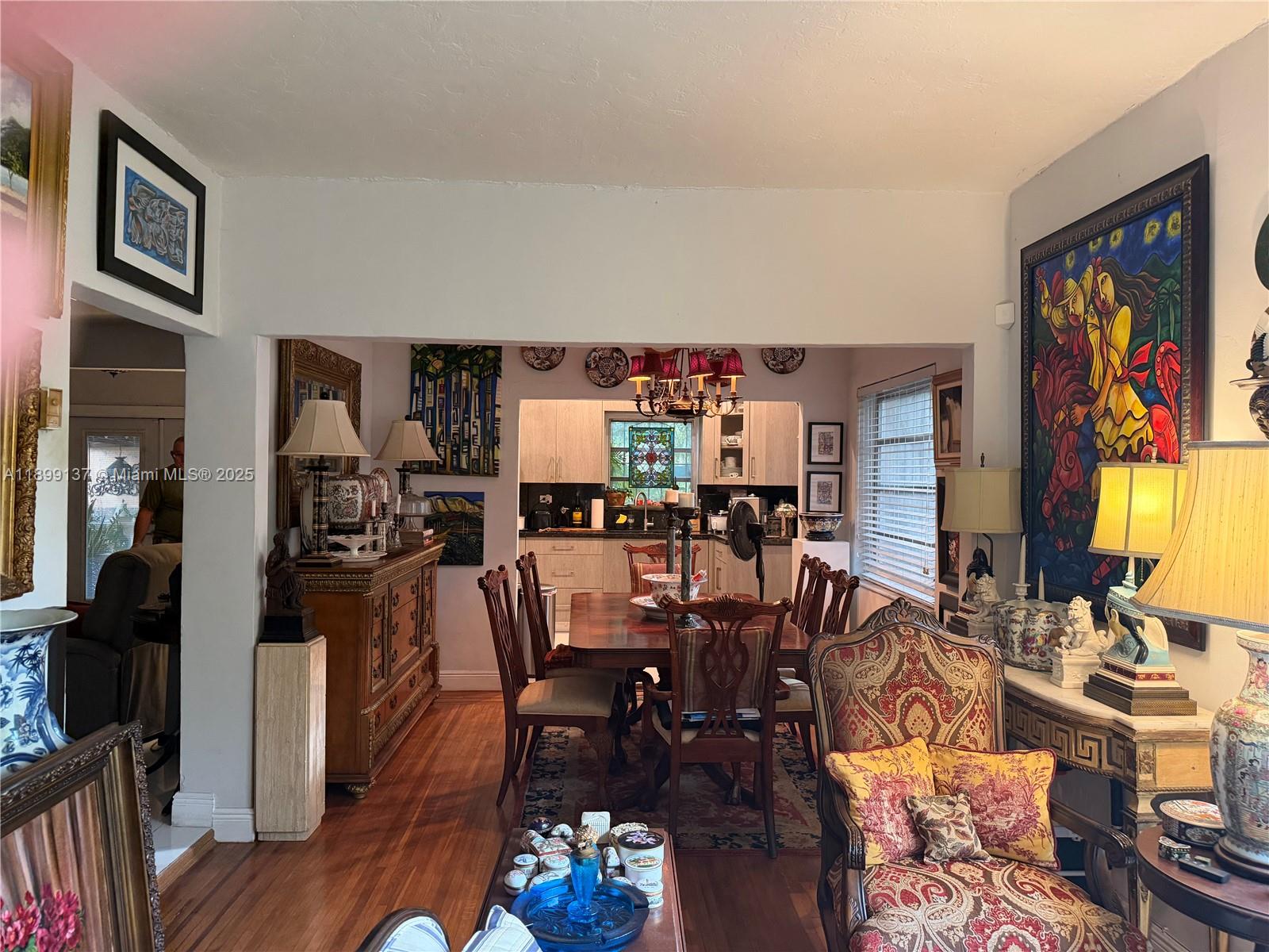 901 Southwest 19th Avenue Miami, FL 33135 - Photo 26 of 60 a view of a dining room with furniture a rug and wooden floor