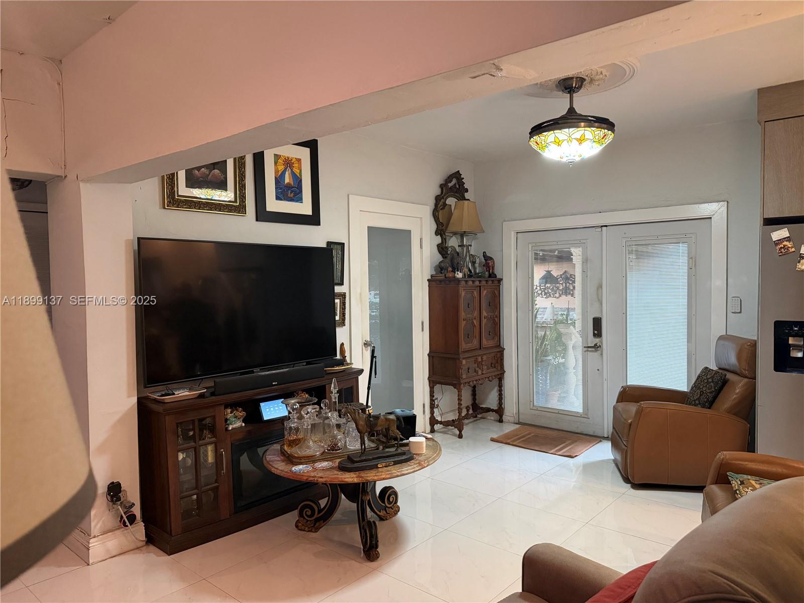 901 Southwest 19th Avenue Miami, FL 33135 - Photo 31 of 60 a living room with furniture and a flat screen tv