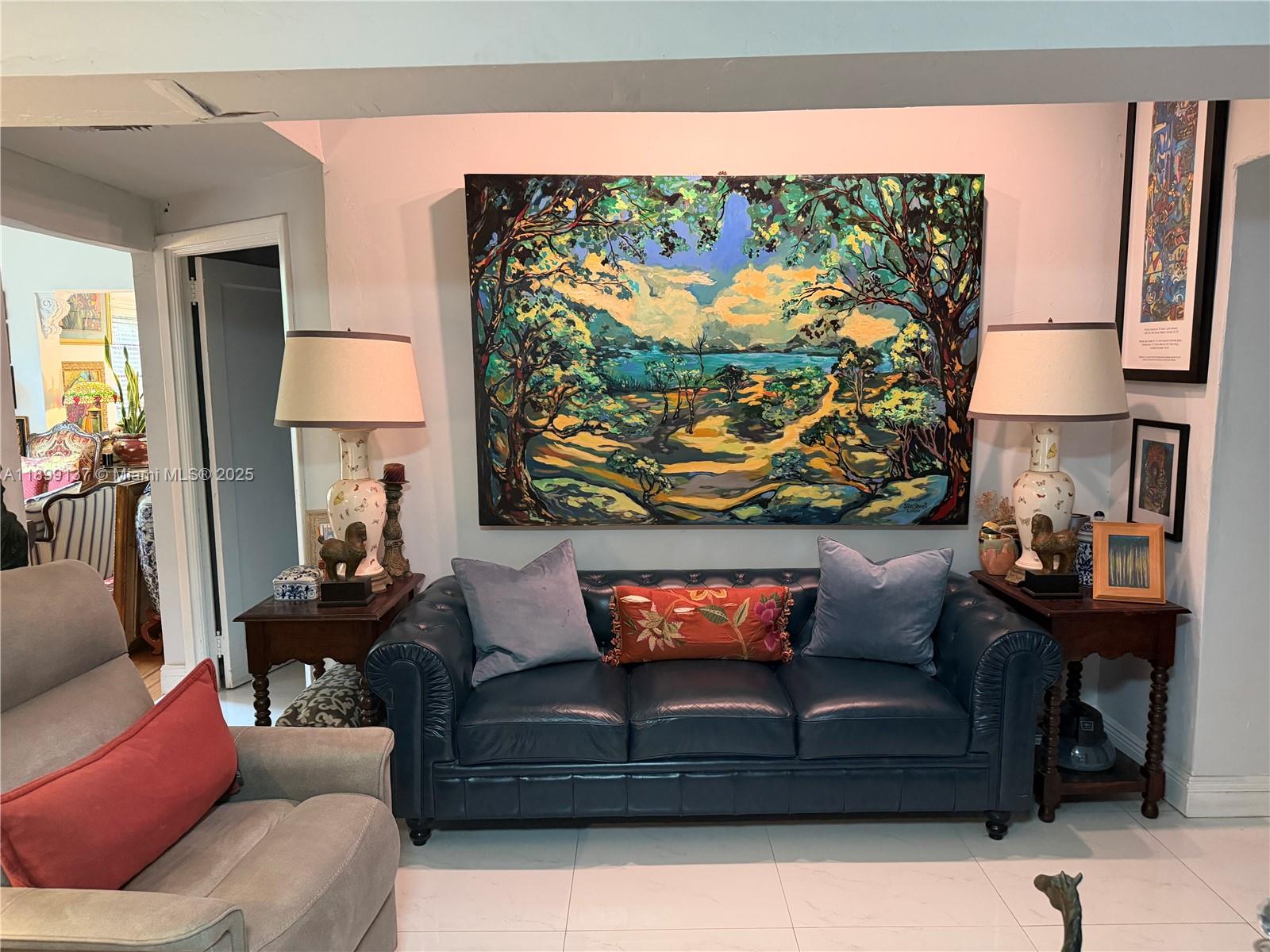 901 Southwest 19th Avenue Miami, FL 33135 - Photo 32 of 60 a living room with furniture and a wall painting