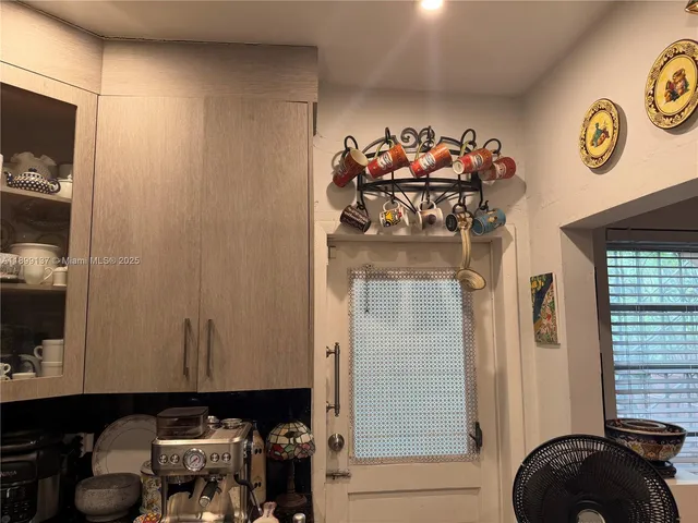 a living room with furniture a window and a table