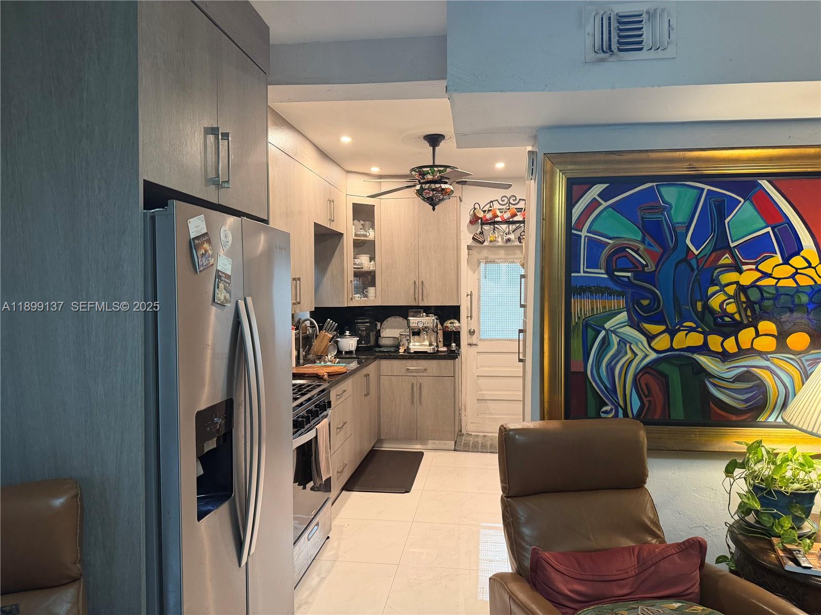 901 Southwest 19th Avenue Miami, FL 33135 - Photo 36 of 60 a kitchen with stainless steel appliances granite countertop a refrigerator and a stove