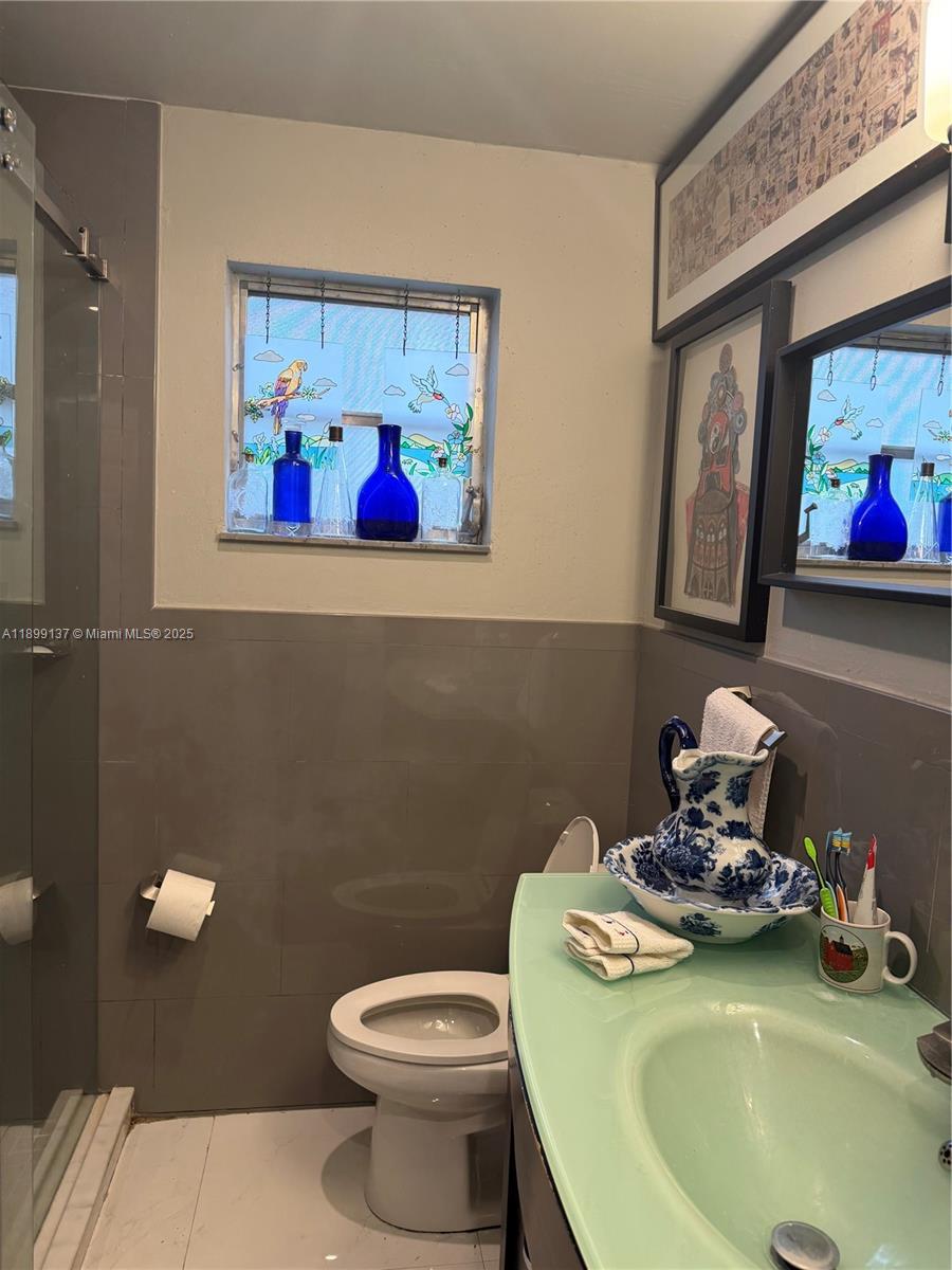 901 Southwest 19th Avenue Miami, FL 33135 - Photo 39 of 60 a bathroom with a toilet a sink and view