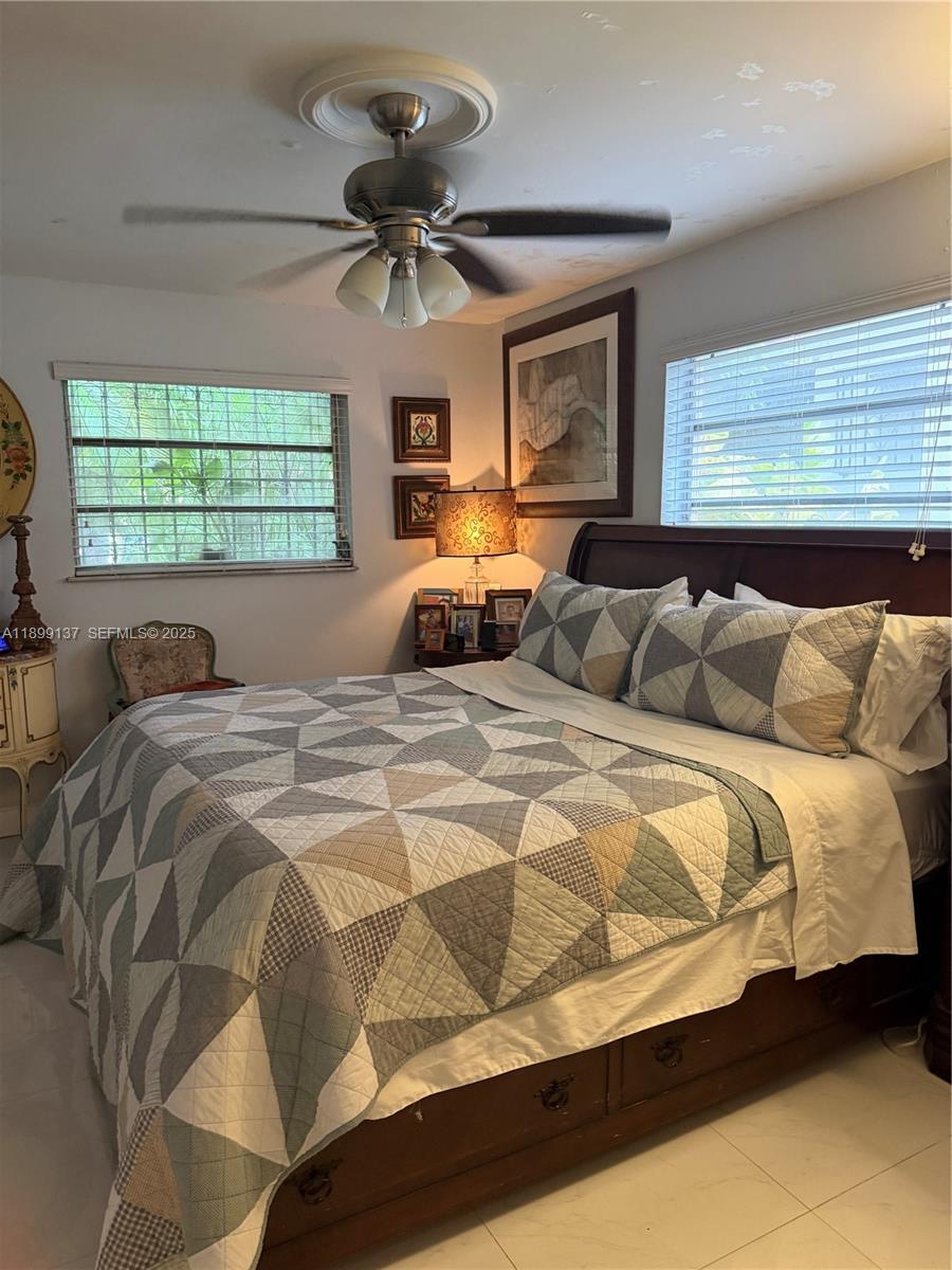 901 Southwest 19th Avenue Miami, FL 33135 - Photo 41 of 60 a bedroom with a bed and a window