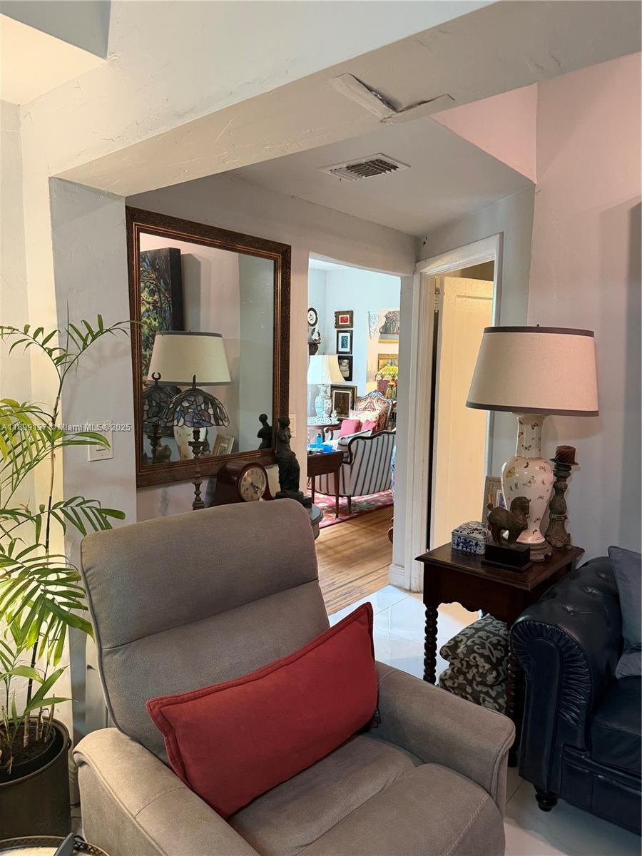 901 Southwest 19th Avenue Miami, FL 33135 - Photo 50 of 60 a living room with furniture and a wooden floor
