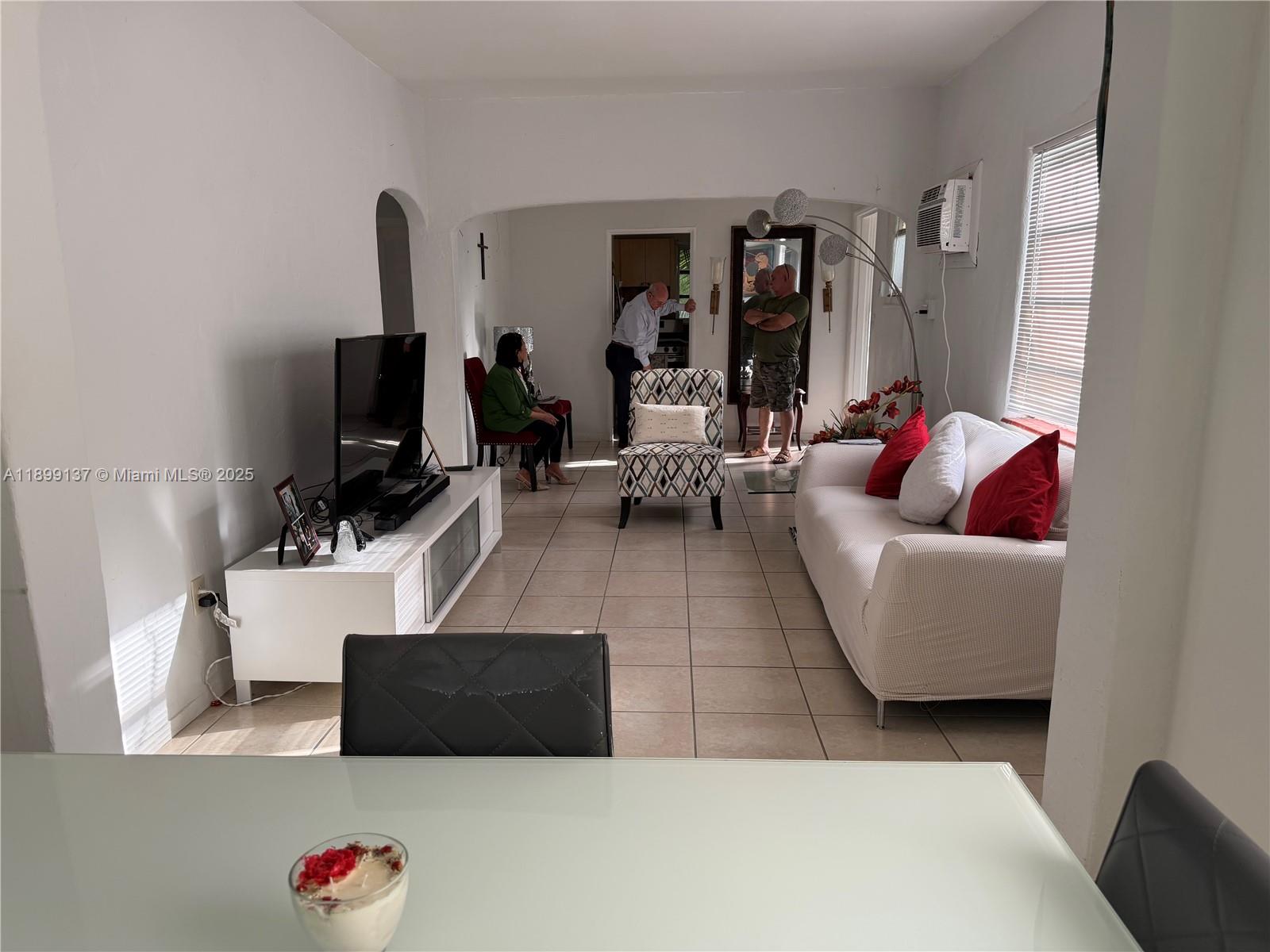 901 Southwest 19th Avenue Miami, FL 33135 - Photo 56 of 60 a living room with furniture and a flat screen tv