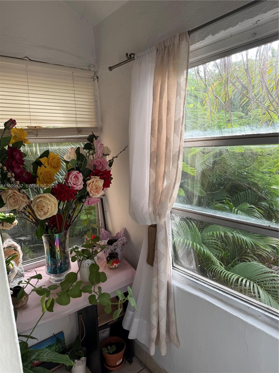 901 Southwest 19th Avenue Miami, FL 33135 - Photo 60 of 60 a room with lots of flowers and view of living room