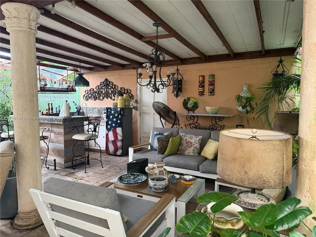 a view of a chairs and table in a patio