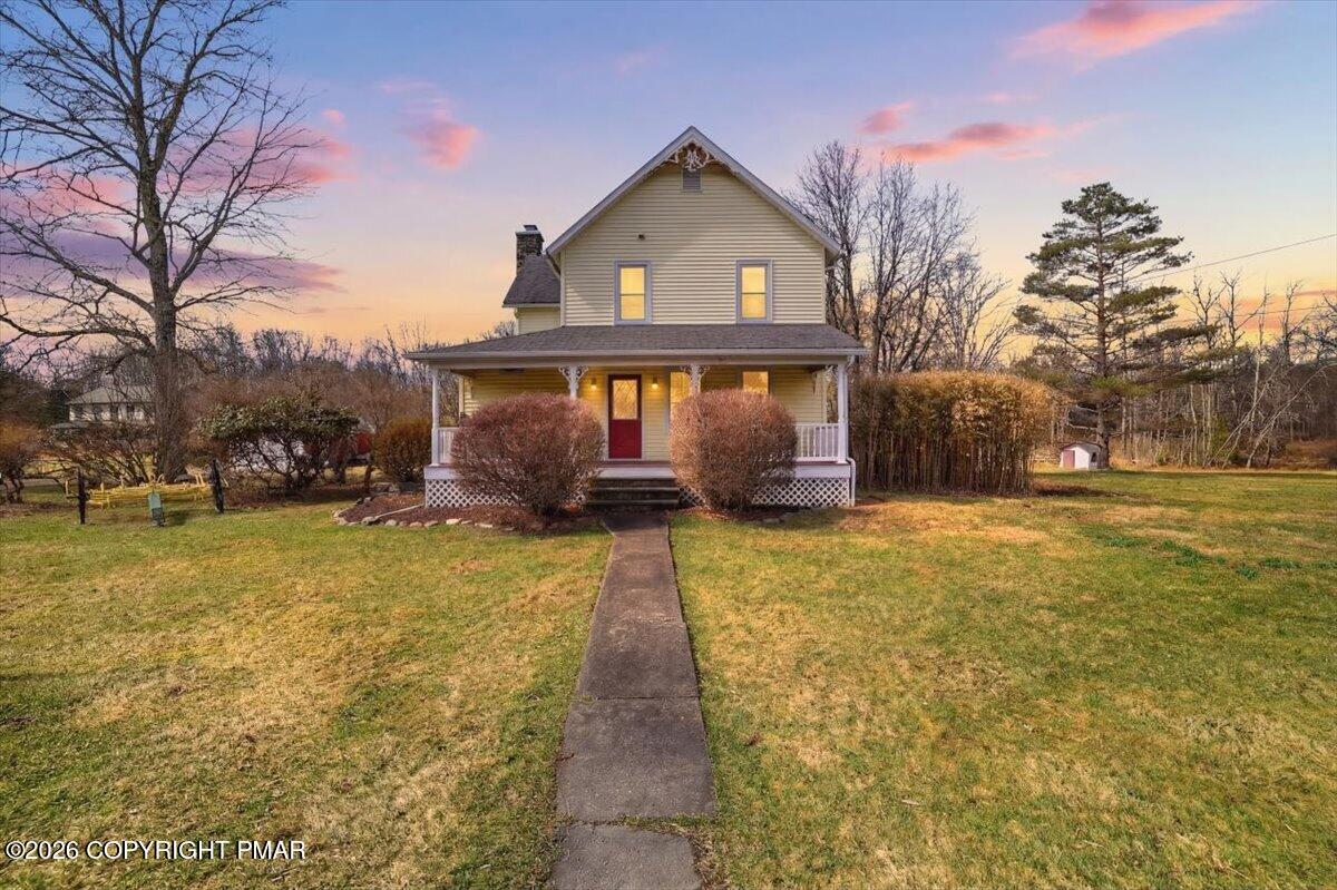 2487 Mountain Road Stroudsburg, PA 18360 - Photo 1 of 61 a front view of house with yard