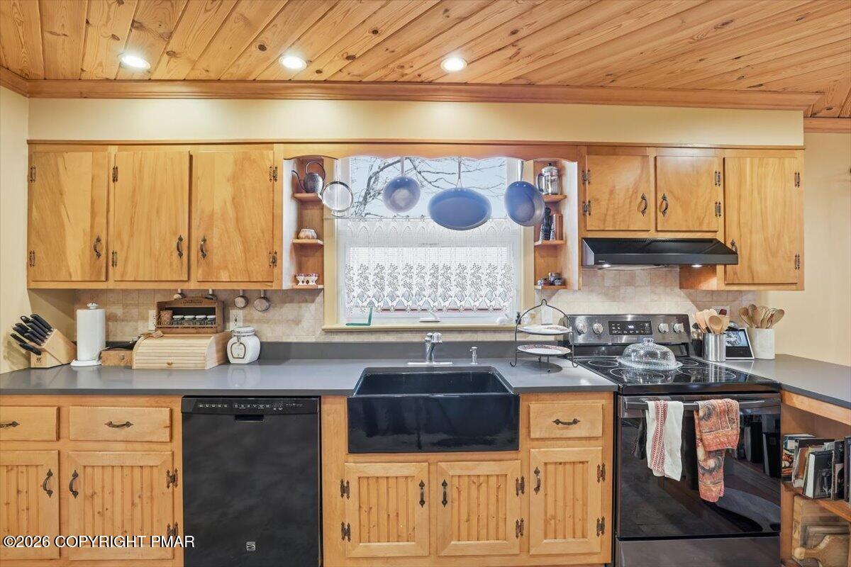 2487 Mountain Road Stroudsburg, PA 18360 - Photo 18 of 61 a kitchen with stainless steel appliances granite countertop a sink stove and cabinets