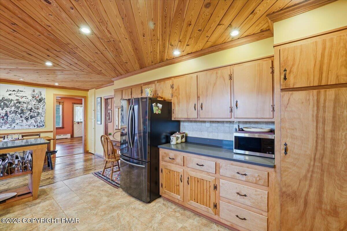2487 Mountain Road Stroudsburg, PA 18360 - Photo 19 of 61 a kitchen with stainless steel appliances a stove refrigerator and cabinets